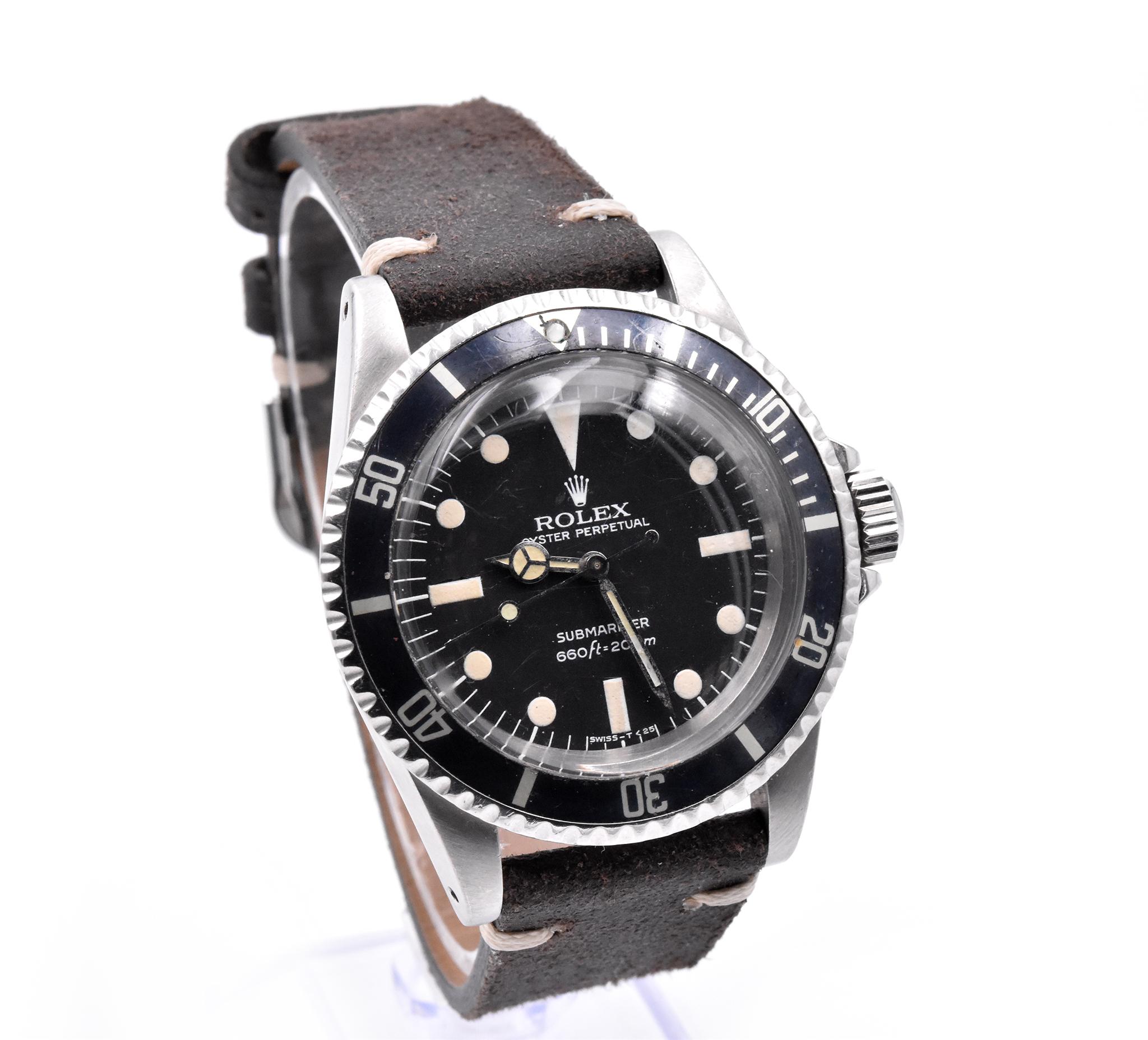 Movement: automatic 1520 movement
Function: hours, minutes, seconds, date
Case: round 40mm stainless-steel case, sapphire crystal, stainless steel bezel with black insert, screw-down crown, waterproof to 200 meters
Band: brown leather strap
Dial: