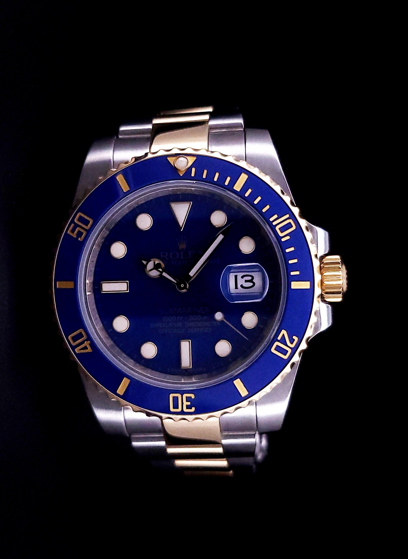 ROLEX SUBMARINER DATE 

-Condition: Pristine, like-new
-Material: 18k Gold and Stainless Steel
-Movement: Swiss Automatic
-Ref: 116613LB
-Case Diameter: 41mm
-Dial: Blue
-Crown: Screw-down
-Clasp: Fold-over

*Watch includes original box and papers.