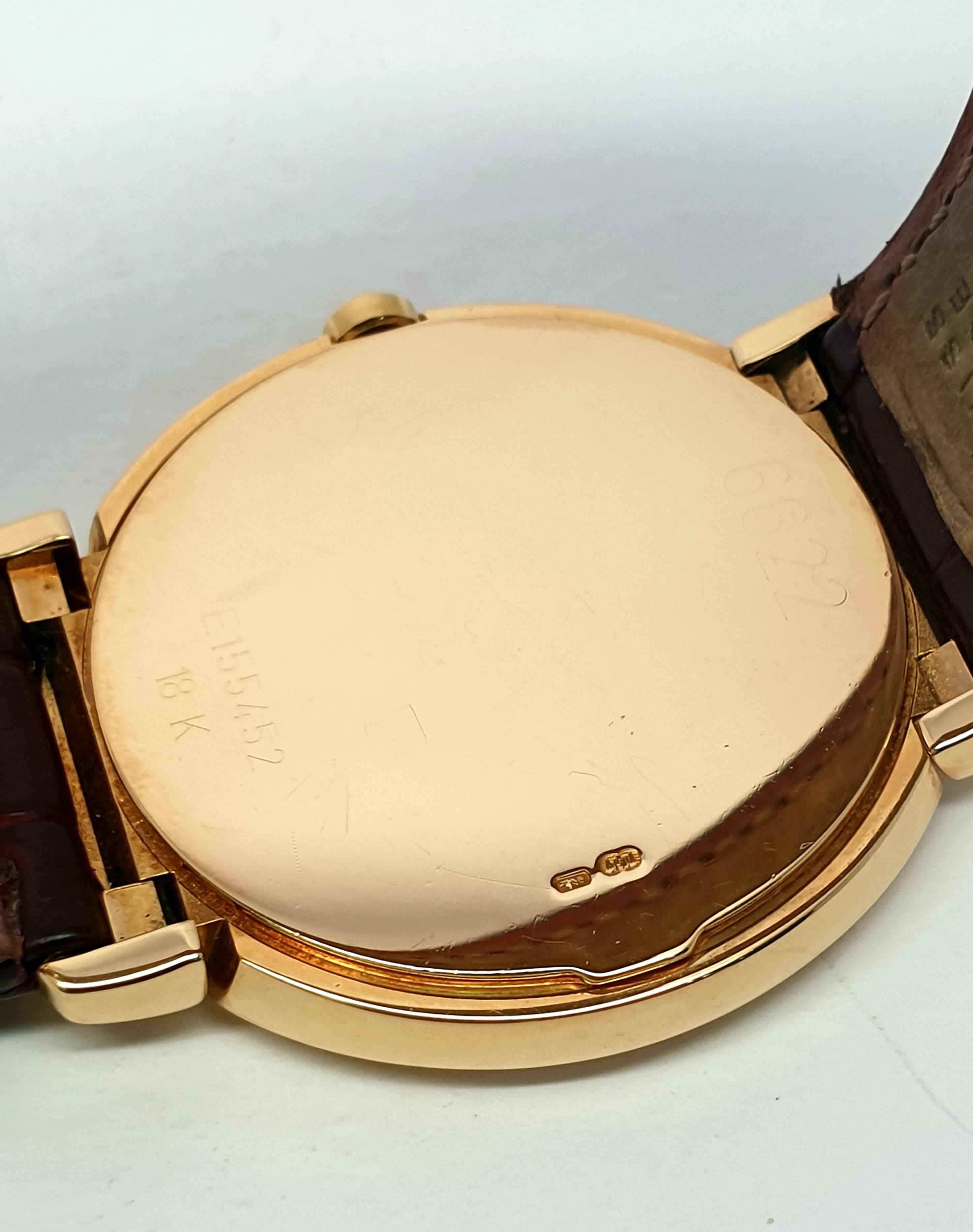 Offering a Rolex Cellini  18 Kt yellow gold watch.Model: 6622 from 1991. The watch comes with burgundy color Rolex  strap shows wear ,but still usable,yellow gold Rolex deployment buckle . The dial is dark gray with Rolex logo in print. The 18 kt