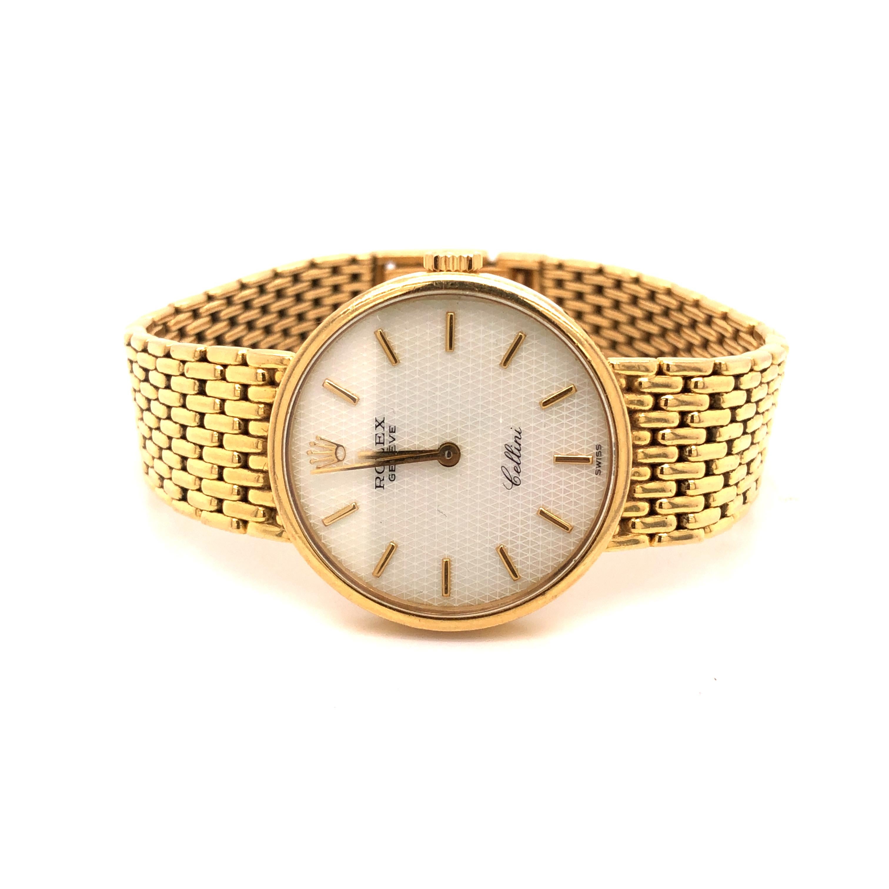 A Rolex 'Cellini' 18K Gold Mother-of-Pearl Watch with a mesh Rolex bracelet. The case measures 26mm in diameter.

Metal: 18K Yellow Gold

Size: 6 1/2