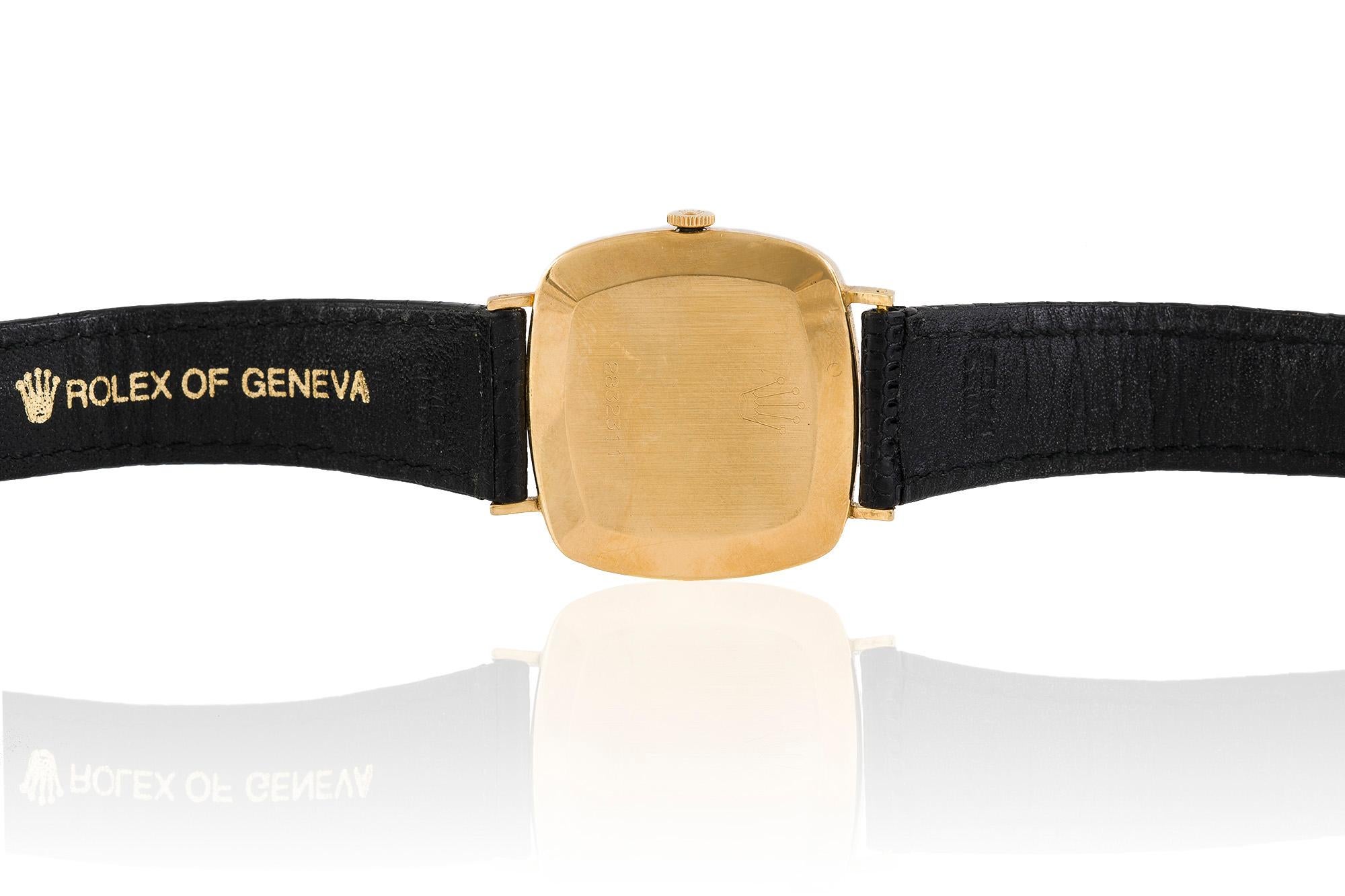 The Rolex cellini watch is finely crafted in 18k gold with black leather.
no # 2832311.
Circa 1975.
