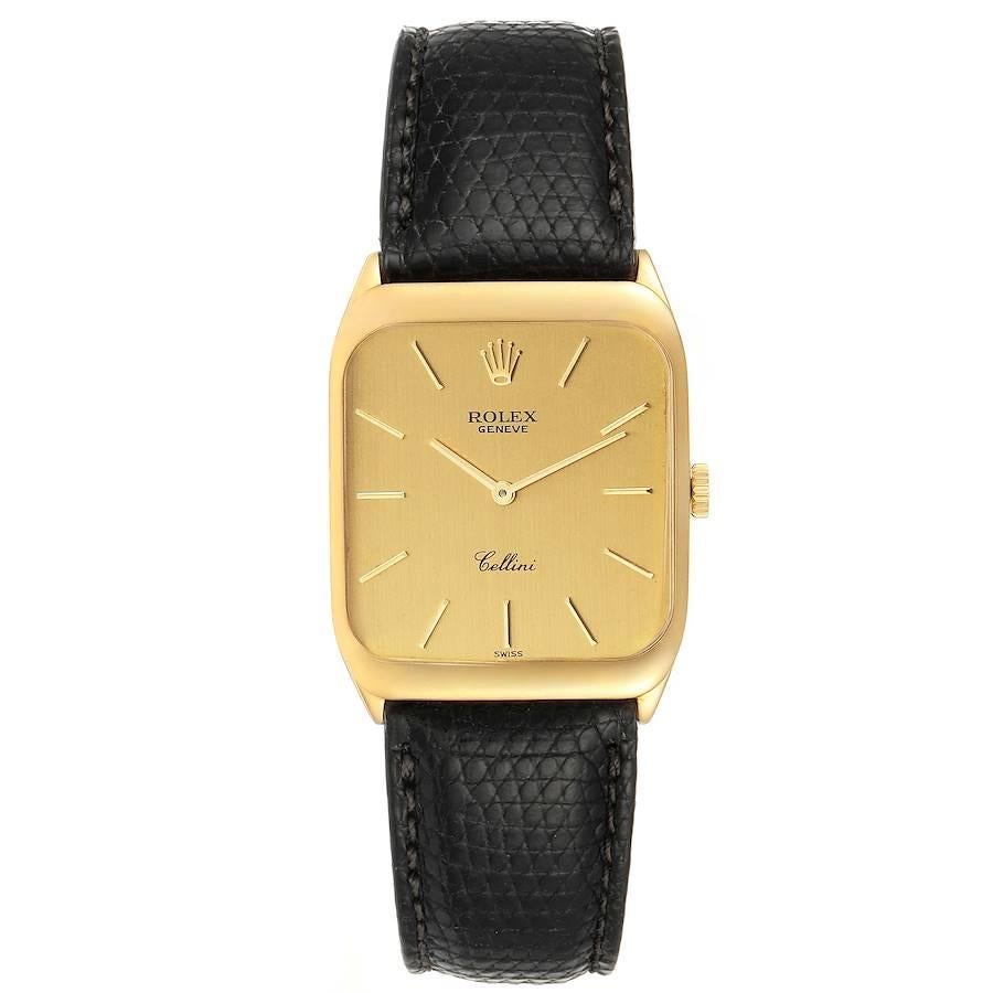Rolex Cellini 18k Yellow Gold Black Strap Mens Vintage Watch 4135. Manual winding movement. 18k yellow gold rectangular case with rounded corners 26.0 x 34.0 mm. Rolex logo on a crown. Hooded lugs. . Scratch-resistant sapphire crystal. Champagne