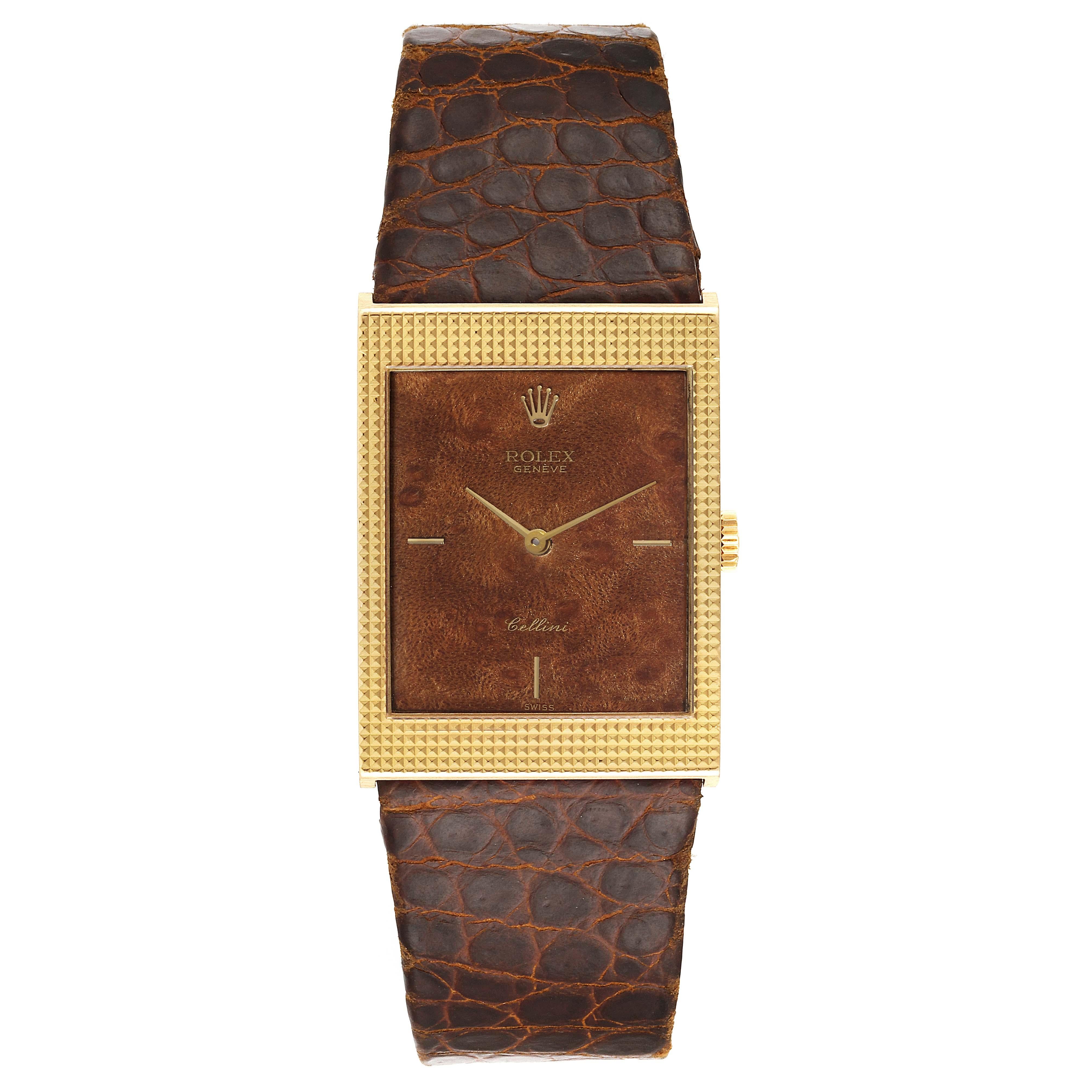 Rolex Cellini 18k Yellow Gold Wooden Dial Vintage Mens Watch 4127. Manual winding movement. 18k yellow gold  rectangular case 24.0 x 33.0 mm. Rolex logo on a crown. Hooded lugs. . Mineral glass crystal. Wooden dial with gold baton hour markers.