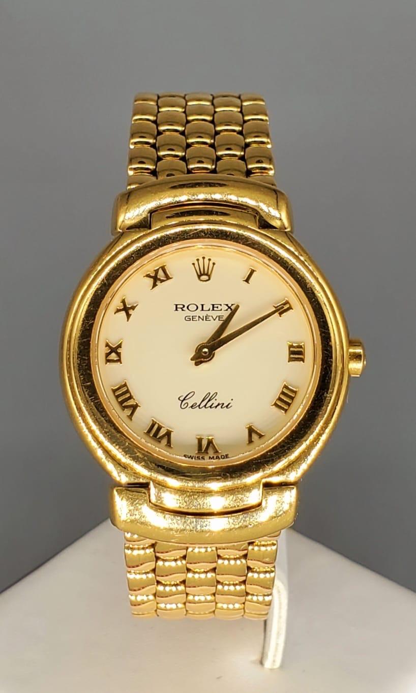 Rolex Cellini in 18k gold with cream dial with yellow gold applied numeral hour markets. The watch is a quartz (battery operated). Comes with original Rolex box. The case is 30mm circa 1992. The entire band is made of 18k solid yellow gold and 18k