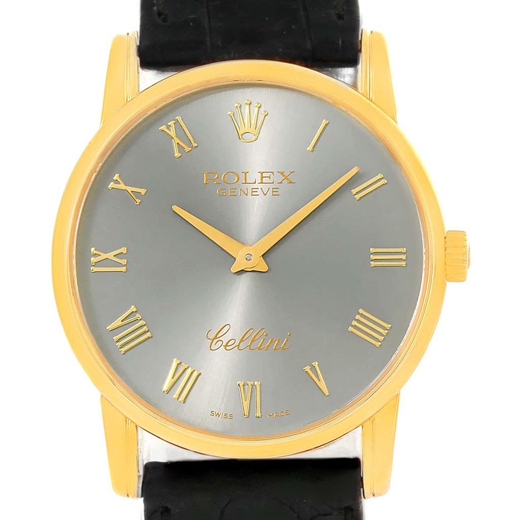 Rolex Cellini Classic 18k Yellow Gold Slate Dial Watch 5116. Manual winding movement. 18k yellow gold slim case 31.8 x 5.5 mm in diameter. Rolex logo on a crown. Scratch resistant sapphire crystal. Flat profile. Slate dial with raised gold roman