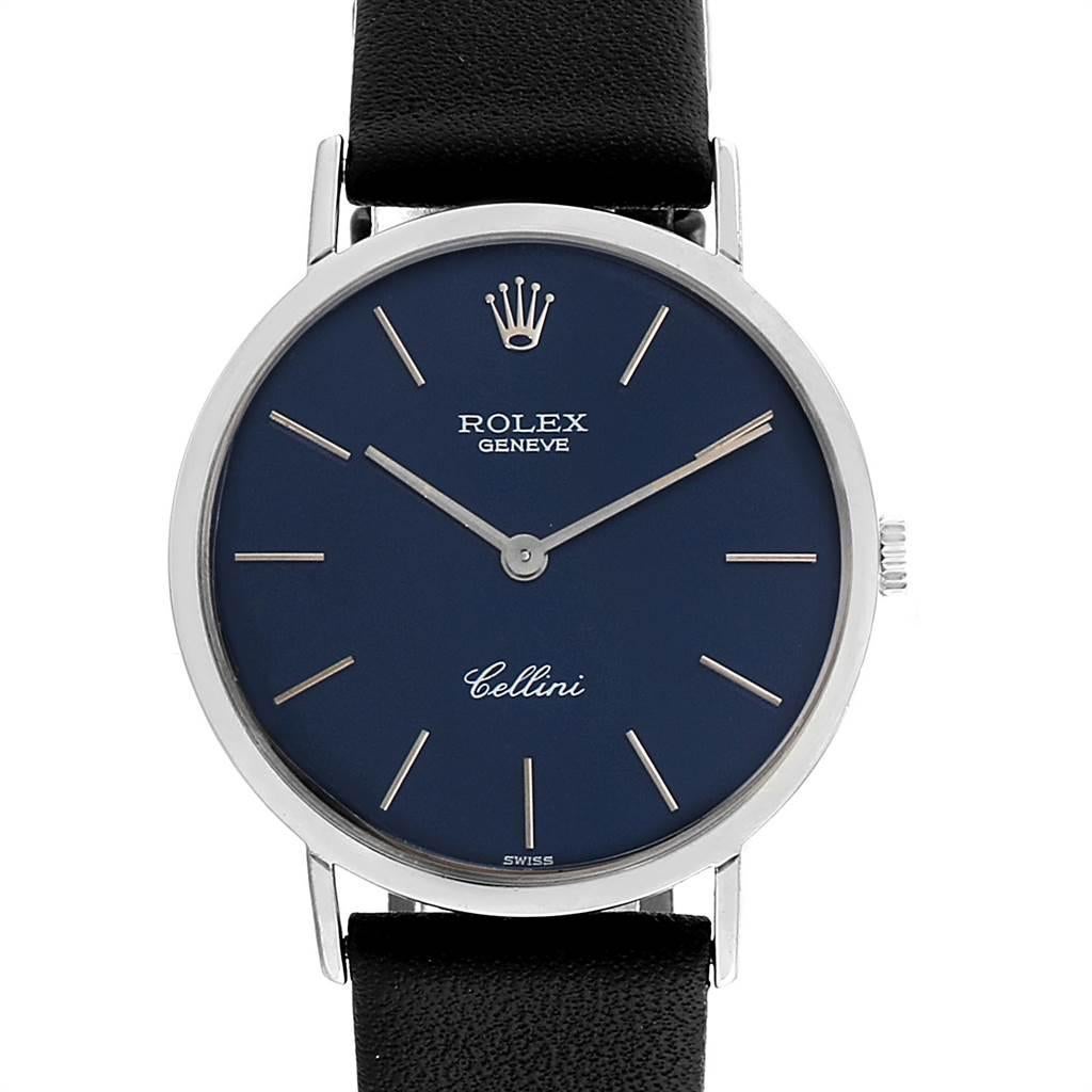 Rolex Cellini Classic 18k White Gold Blue Dial Mens Watch 4112. Manual winding movement. 18k white gold slim case 30.5 mm in diameter. Rolex logo on a crown. Scratch resistant sapphire crystal. Flat profile. Blue dial with raised gold baton hour