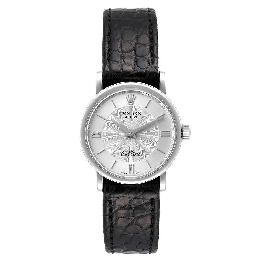 Rolex Cellini Classic 18k White Gold Silver Dial Black Strap Ladies Watch 6110. Quartz movement. 18k white gold slim case 26.0 mm in diameter. . Scratch resistant sapphire crystal. Flat profile. Decorated silver dial with raised roman numerals and