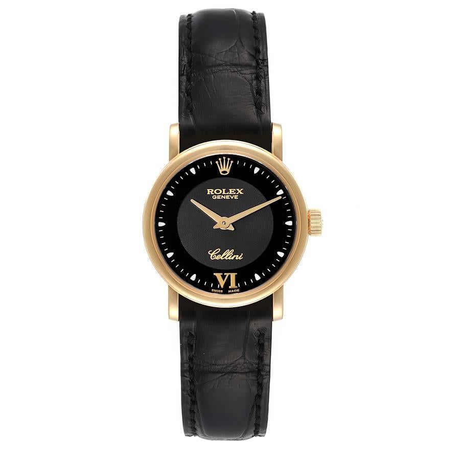 Rolex Cellini Classic 18k Yellow Gold Black Dial Ladies Watch 6110 Card. Quartz movement. 18k yellow gold slim case 26.0 mm in diameter. . Scratch resistant sapphire crystal. Flat profile. Black dial with dot hour markers and applied gold roman