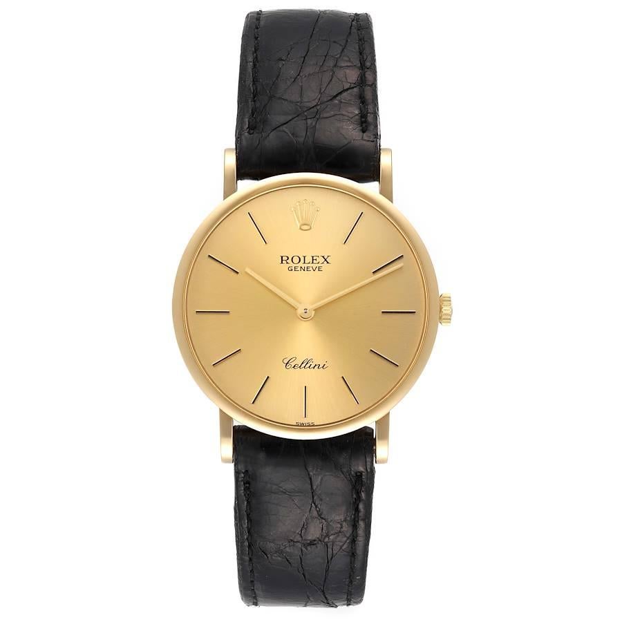 Rolex Cellini Classic 18k Yellow Gold Black Strap Mens Watch 5112. Manual winding movement. 18k yellow gold slim case 32.0 mm in diameter. . Scratch resistant sapphire crystal. Flat profile. Champagne dial with raised gold baton hour markers. Custom