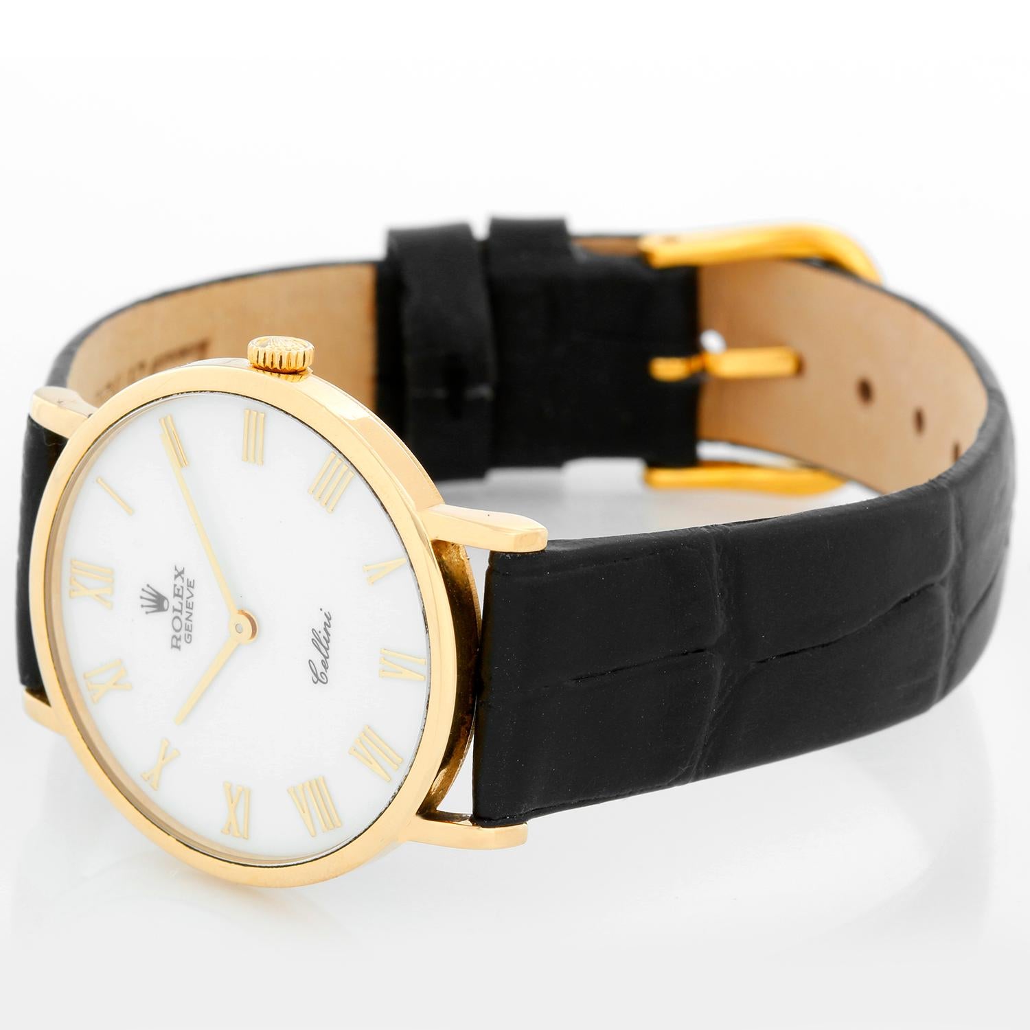 Rolex Cellini Classic 18k Yellow Gold Men's Watch 5112 White Roman Dial -  Manual winding. 18k yellow gold case (32mm diameter). White dial with gold Roman numerals. Strap band with 18k yellow gold Rolex buckle. Pre-owned with box.