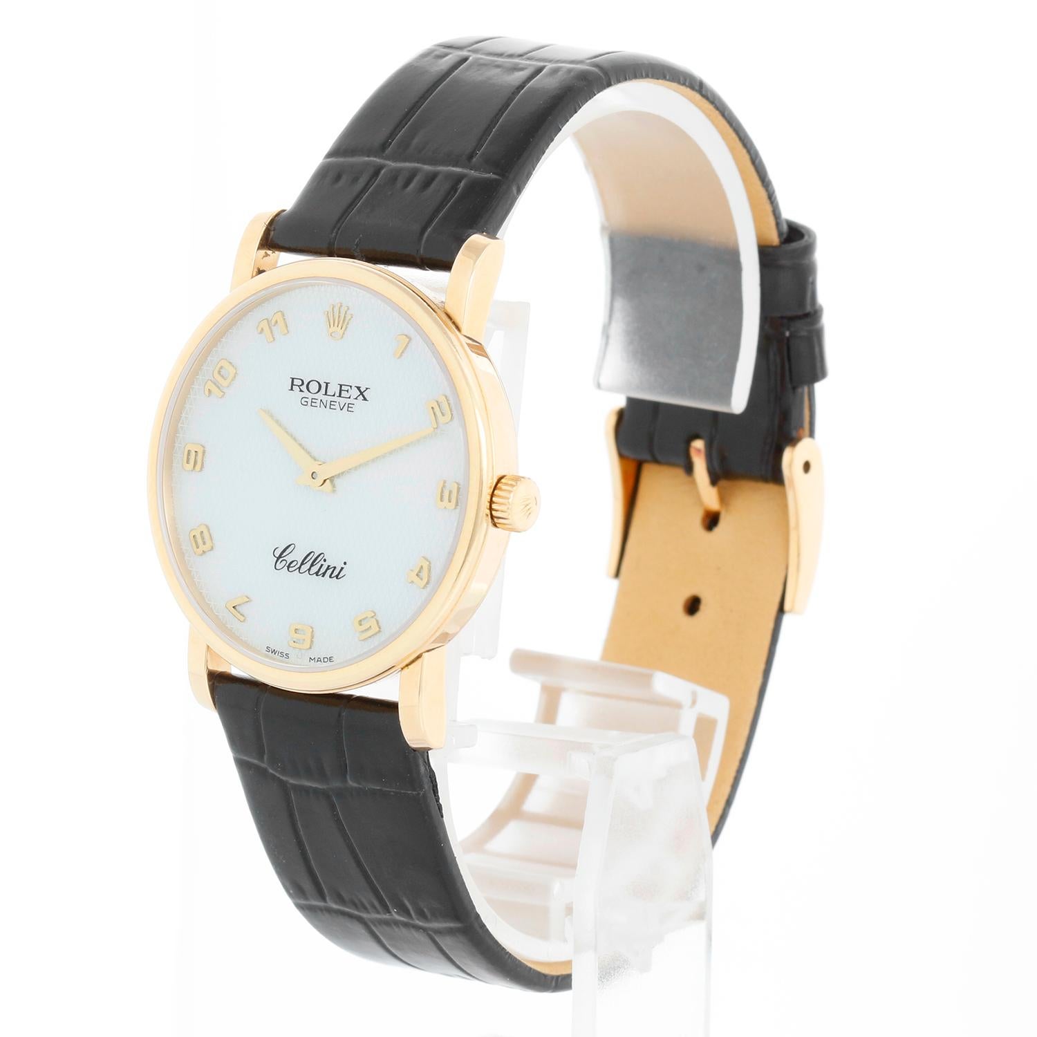 Rolex Cellini Classic 18k Yellow Gold Men's Watch 5115 - Manual winding. 18k yellow gold case (32 mm). Mother of Pearl Honeycomb dial with Arabic numerals. Black strap band with 18k yellow gold Rolex buckle. Pre-owned with custom box. 
