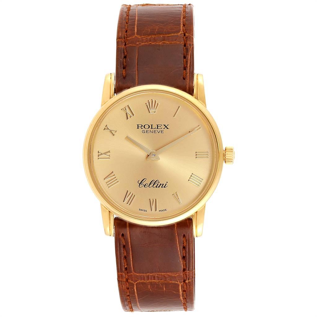 Rolex Cellini Classic 18k Yellow Gold Roman Dial Brown Strap Watch 5116. Manual winding movement. 18k yellow gold slim case 31.8 x 5.5 mm in diameter. Rolex logo on a crown. Scratch resistant sapphire crystal. Flat profile. Champagne dial with