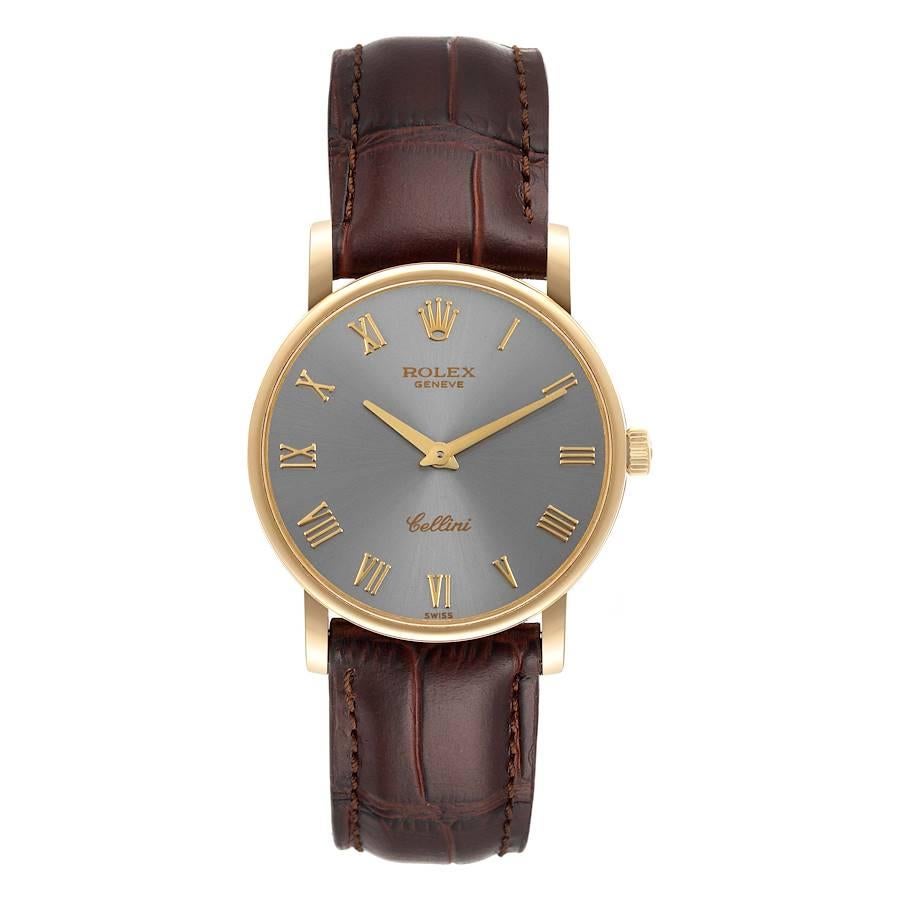 Rolex Cellini Classic 18K Yellow Gold Slate Roman Dial Watch 5115. Manual winding movement. 18K yellow gold slim case 31.8 x 5.5 mm in diameter. Rolex logo on a crown. . Scratch resistant sapphire crystal. Flat profile. Slate dial with raised gold