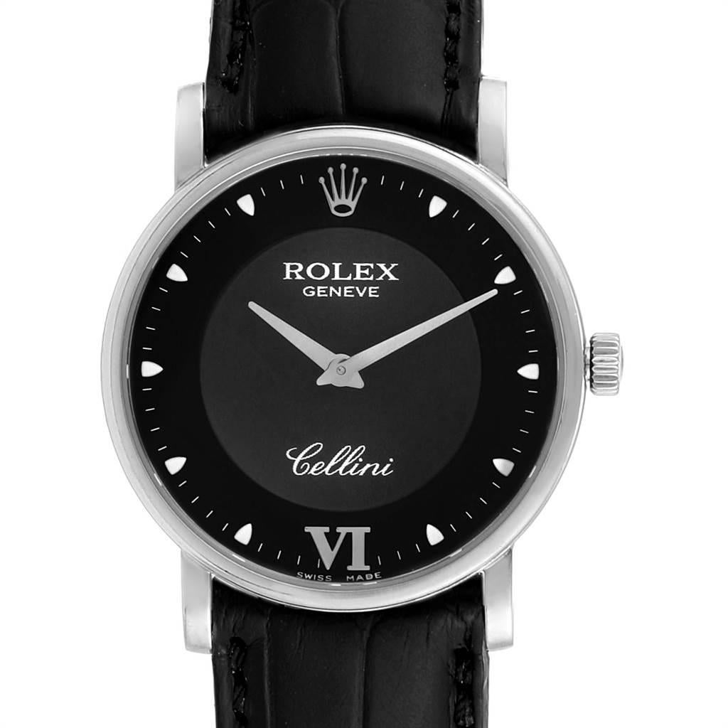 Rolex Cellini Classic 32mm White Gold Black Dial Mens Watch 5115. Manual winding movement. 18K white gold slim case 31.8 x 5.5 mm in diameter. Rolex logo on a crown. Scratch resistant sapphire crystal. Flat profile. Black dial with dot hour markers