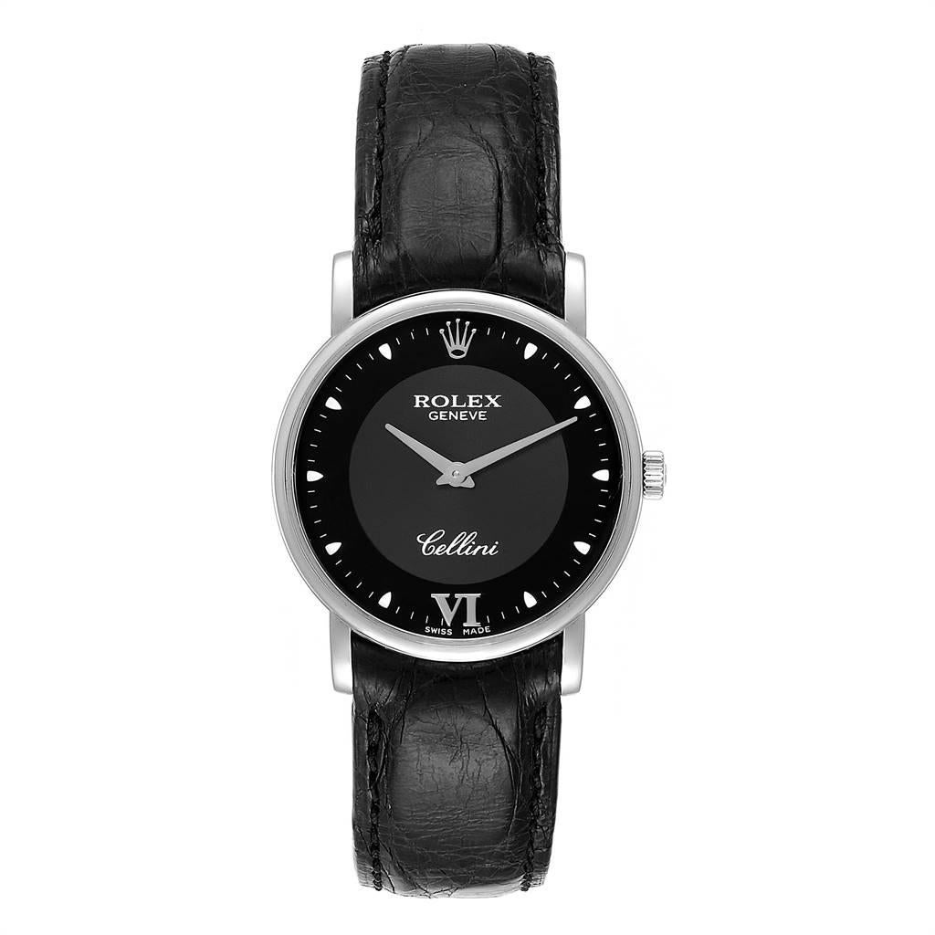 Rolex Cellini Classic 32mm White Gold Black Dial Mens Watch 5115. Manual winding movement. 18K white gold slim case 31.8 x 5.5 mm in diameter. Rolex logo on a crown. Scratch resistant sapphire crystal. Flat profile. Black dial with dot hour markers