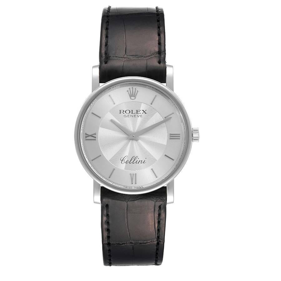 Rolex Cellini Classic White Gold Decorated Silver Dial Mens Watch 5115. Manual winding movement. 18K white gold slim case 32 mm in diameter. 5.5 mm case thickness. Rolex logo on the crown. . Scratch resistant sapphire crystal. Flat profile. Silver