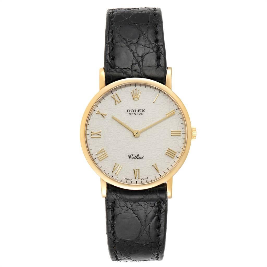 Rolex Cellini Classic Yellow Gold Anniversary Dial Black Strap Watch 5112. Manual winding movement. 18k yellow gold slim case 32.0 mm in diameter. Scratch resistant sapphire crystal. Flat profile. Ivory jubilee (annyversary) dial with raised gold