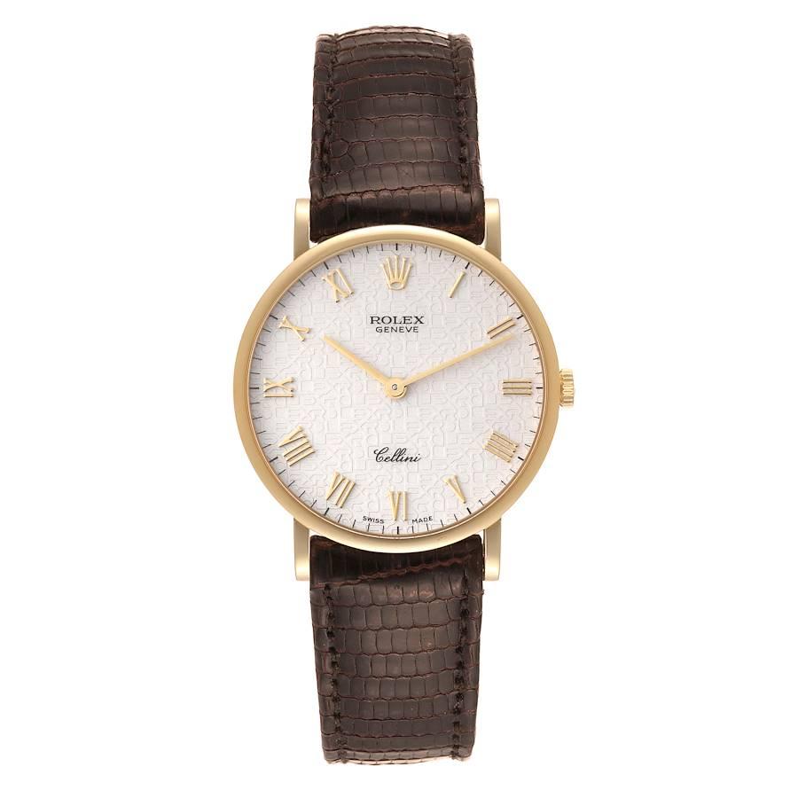 Rolex Cellini Classic Yellow Gold Anniversary Dial Brown Strap Watch 5112. Uhrwerk mit Handaufzug. 18k Gelbgold schlankes Gehäuse 32,0 mm im Durchmesser. . Kratzfestes Saphirglas. Flaches Profil. Elfenbeinfarbenes Jubiläumszifferblatt mit erhabenen