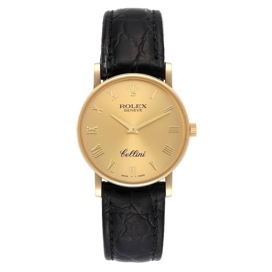 Rolex Cellini Classic Yellow Gold Black Strap Mens Watch 5115. Manual winding movement. 18K yellow gold slim case 31.8 x 5.5 mm in diameter. Rolex logo on a crown. . Scratch resistant sapphire crystal. Flat profile. Champagne dial with raised gold