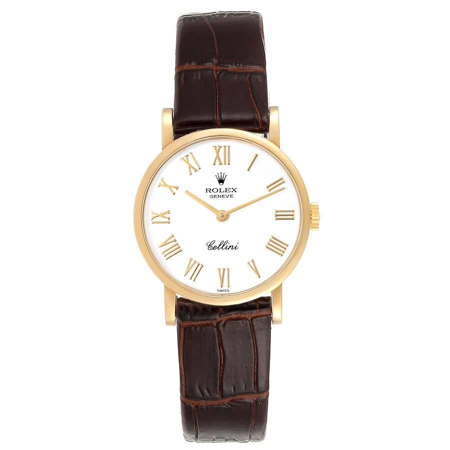 Rolex Cellini Classic Yellow Gold Brown Strap Ladies Watch 5109. Manual winding movement. 18k yellow gold slim case 26.0 mm in diameter. . Scratch resistant sapphire crystal. Flat profile. White dial with raised gold roman numerals. Custom brown