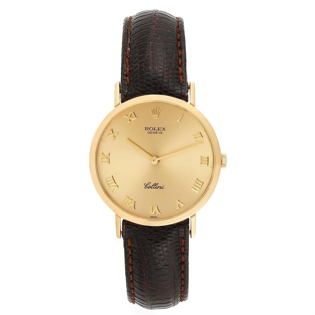 Rolex Cellini Classic Yellow Gold Brown Strap Mens Watch 4112. Manual winding movement. 18k yellow gold slim case 30.5 mm in diameter. Rolex logo on a crown. 18k yellow gold bezel. Scratch resistant sapphire crystal. Flat profile. Champagne dial