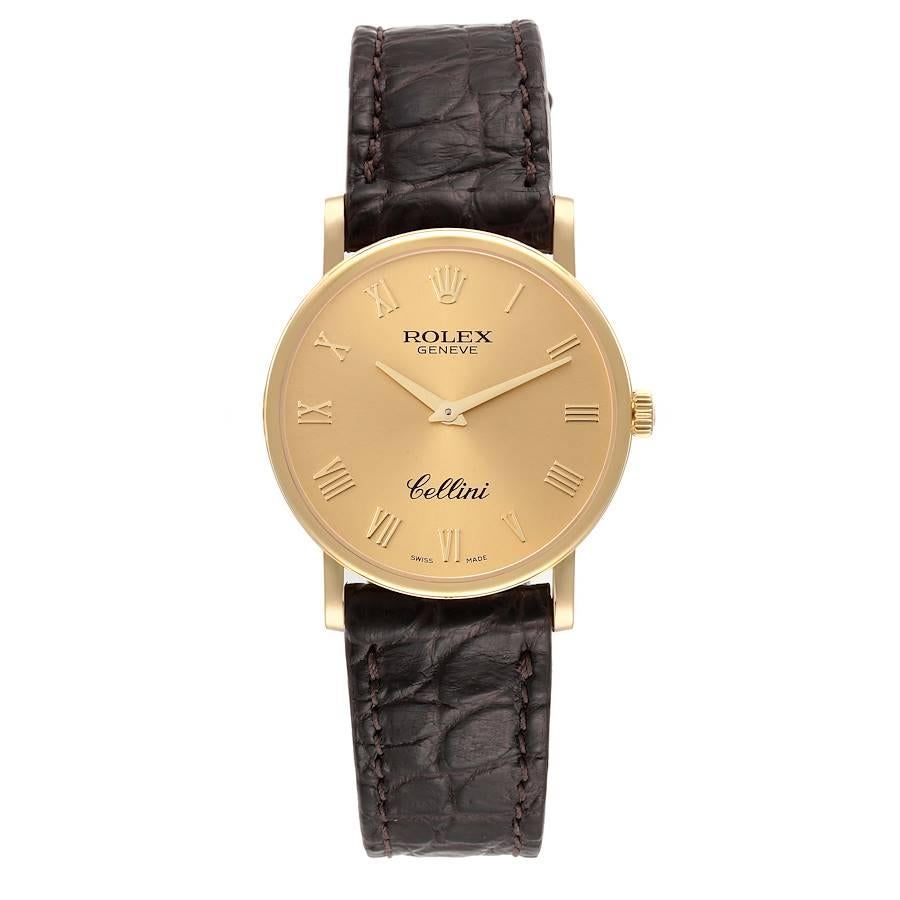 Rolex Cellini Classic Yellow Gold Brown Strap Mens Watch 5115. Manual winding movement. 18K yellow gold slim case 31.8 x 5.5 mm in diameter. Rolex logo on a crown. . Scratch resistant sapphire crystal. Flat profile. Champagne dial with raised gold