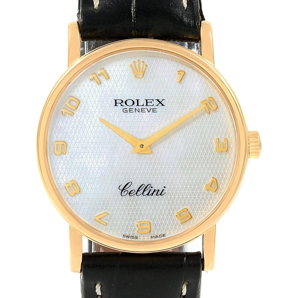 Rolex Cellini Classic Yellow Gold MOP Dial Black Strap Watch 5115. Manual winding movement. 18K yellow gold slim case 31.8 x 5.5 mm in diameter. Rolex logo on a crown. Scratch resistant sapphire crystal. Flat profile. Textured mother of pearl dial