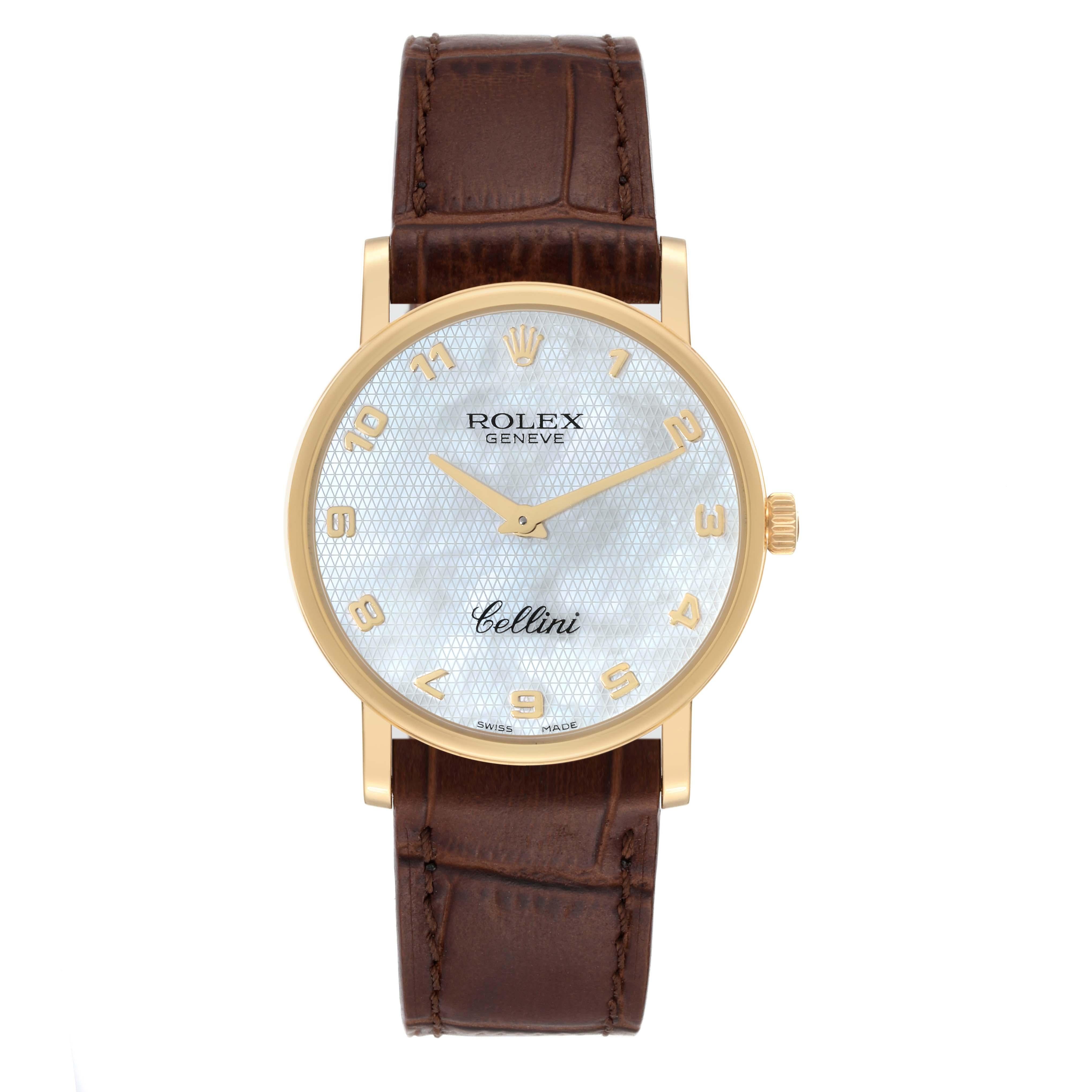 Rolex Cellini Classic Yellow Gold Mother of Pearl Dial Mens Watch 5115 Card. Manual winding movement. 18K yellow gold slim case 32mm in diameter. 5.5mm case thickness. Rolex logo on the crown. . Scratch resistant sapphire crystal. Flat profile.