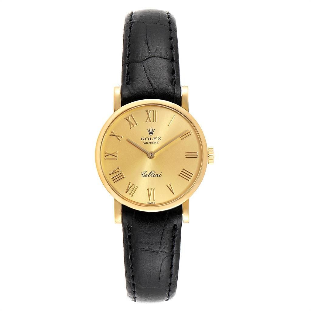 Rolex Cellini Classic Yellow Gold Roman Numerals Ladies Watch 5109. Manual winding movement. 18k yellow gold slim case 26.0 mm in diameter. Scratch resistant sapphire crystal. Flat profile. Champagne dial with raised gold roman numerals. Black