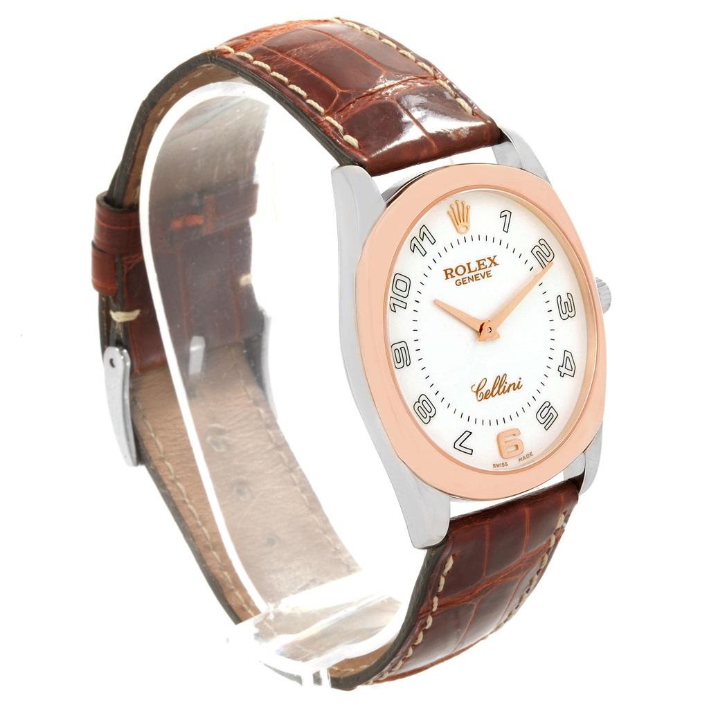 Rolex Cellini Danaos 18K White Rose Gold Brown Strap Mens Watch 4233. Manual winding movement. 18k white and rose gold rounded rectangular case 34.0 mm. Rolex logo on a crown. 18K rose gold fixed bezel. Scratch resistant sapphire crystal. White dial