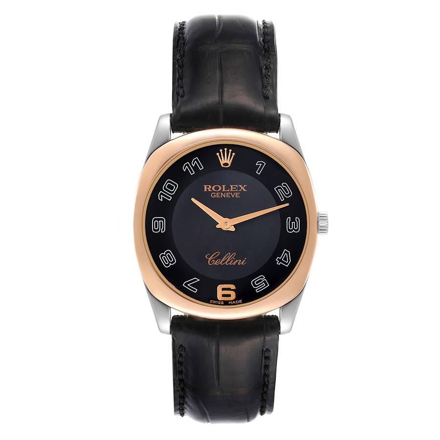 Rolex Cellini Danaos White and Rose Gold Black Strap Mens Watch 4233. Manual winding movement. 18k white and rose gold rounded rectangular case 34.0 mm. Rolex logo on a crown. . Scratch resistant sapphire crystal. Black dial with oversized arabic