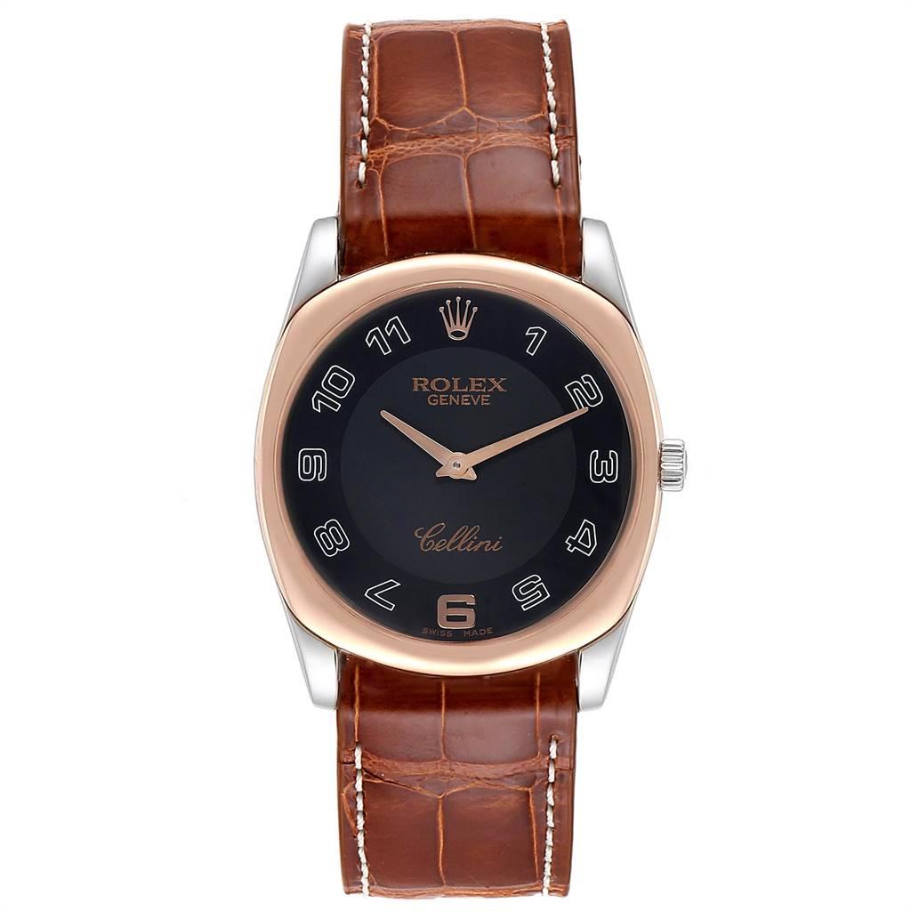Rolex Cellini Danaos White and Rose Gold Brown Strap Mens Watch 4233. Manual winding movement. 18k white and rose gold rounded rectangular case 34.0 mm. Rolex logo on a crown. Scratch resistant sapphire crystal. Black dial with oversized arabic