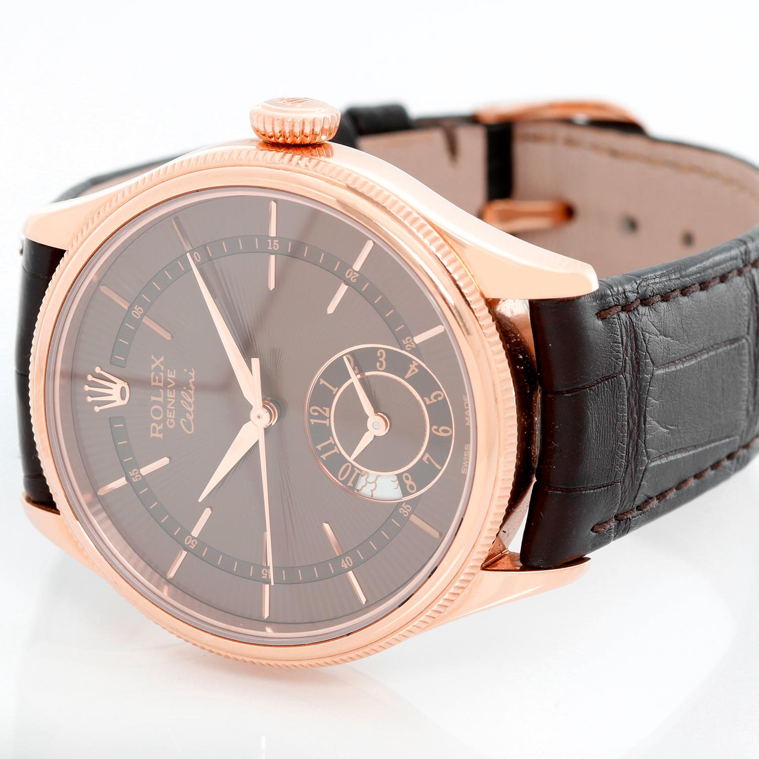 Rolex Cellini Dual Time 18K Rose Gold Men's Watch - Automatic winding . 18K Everrose; Rose Gold ( 39 mm). Chocolate dial with sub dial at 6 o'clock. Brown leather strap with Rose gold deployant clasp. Pre-owned with Rolex box and card. Like new,