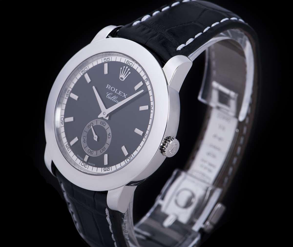 A Platinum Cellini Gents Wristwatch, black dial with applied hour markers, small seconds at 6 0'clock, a fixed platinum bezel, an original black leather strap with an original platinum pin buckle, sapphire glass, manual wind movement, in excellent
