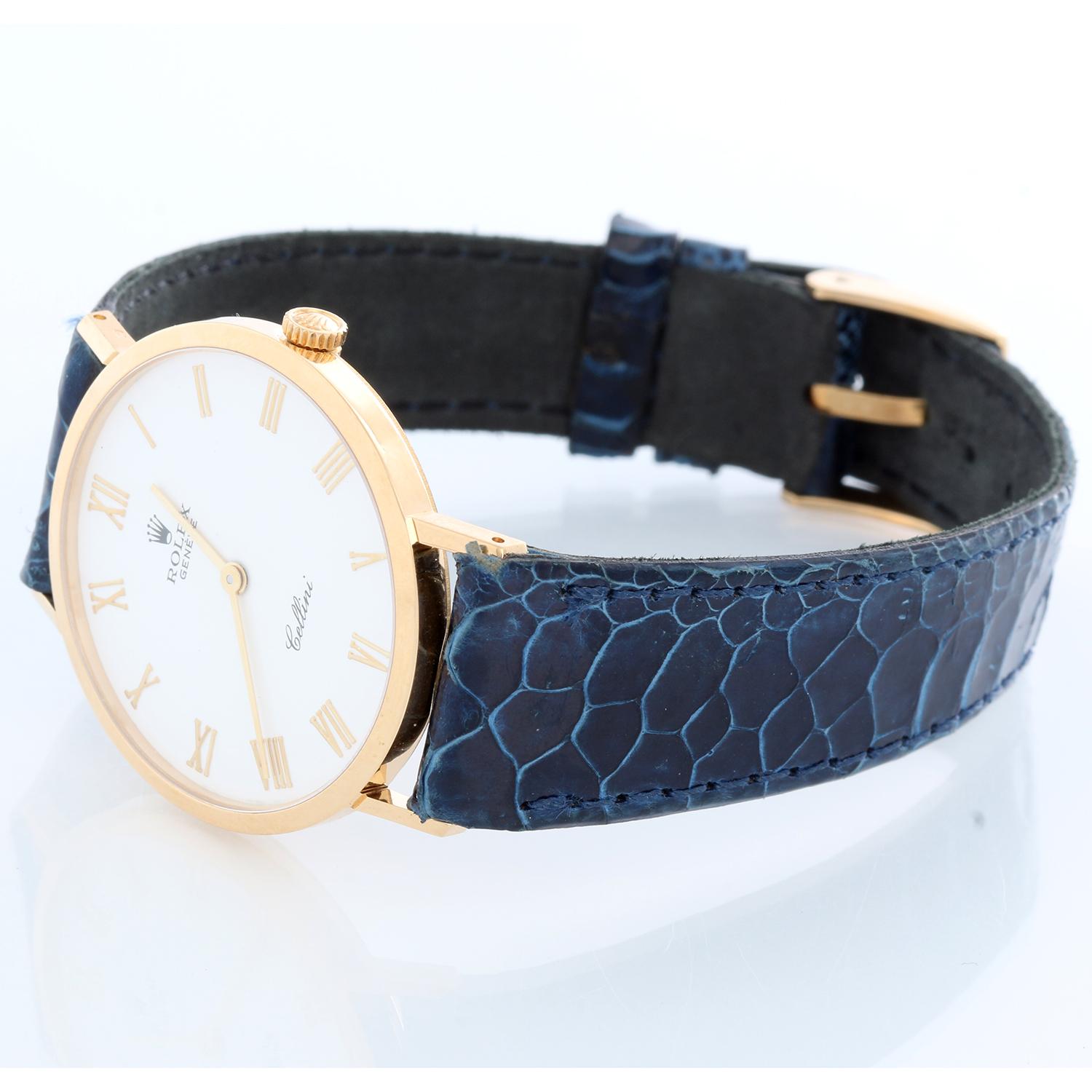 Rolex Cellini Men's 18k Yellow Gold Watch on Strap Band Mod. 4112 - Manual winding. 18k yellow gold case (32mm diameter). White dial with gold Roman numerals . Blue alligator strap with 18K Rolex buckle . Pre-owned with custom box.