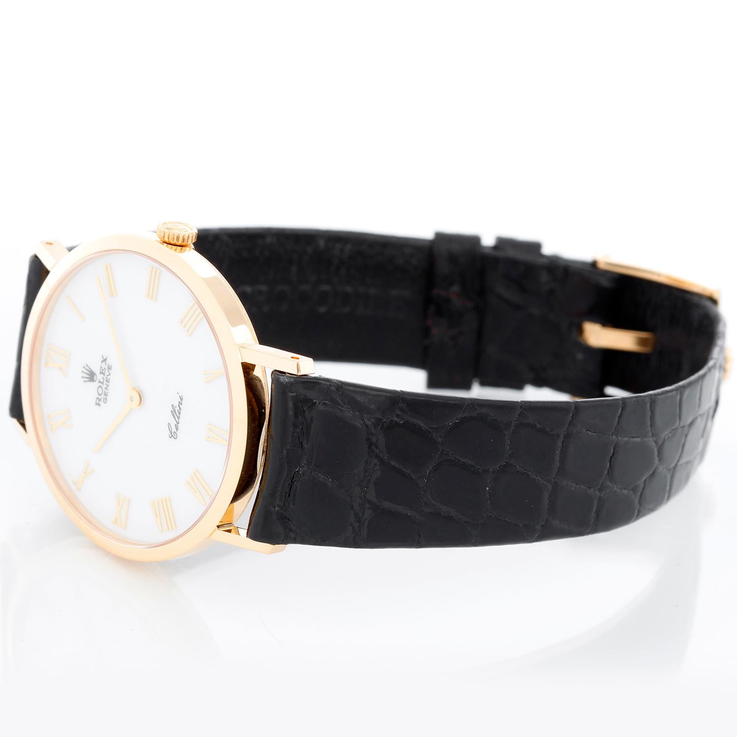 Rolex Cellini Men's 18k Yellow Gold Watch on Strap Band Mod. 4112 - Manual winding. 18k yellow gold case (32mm diameter). White dial with gold Roman numerals. Black Rolex alligator strap with 18K Rolex buckle. Pre-owned with Rolex box and papers
