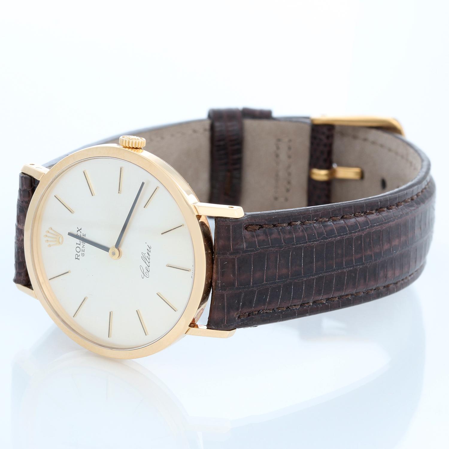Rolex Cellini Men's 18k Yellow Gold Watch on Strap Band Mod. 4112 - Manual winding. 18k yellow gold case (32mm diameter). Silver dial with stick hour markers. Brown lizard strap with tang buckle. Pre-owned with custom box.