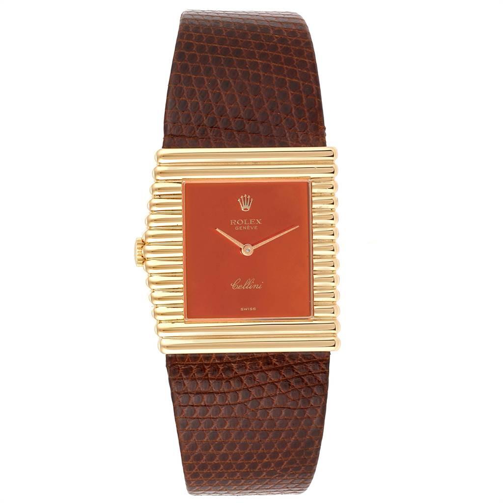 Rolex Cellini Midas Yellow Gold Orange Mirror Dial Vintage Watch 4017. Manual winding movement. 18k yellow gold rectangular asymmetrical case 27.5 x 28.0 mm. Winding crown at 9. 18k yellow gold wide ribbed bezel. Scratch resistant sapphire crystal.