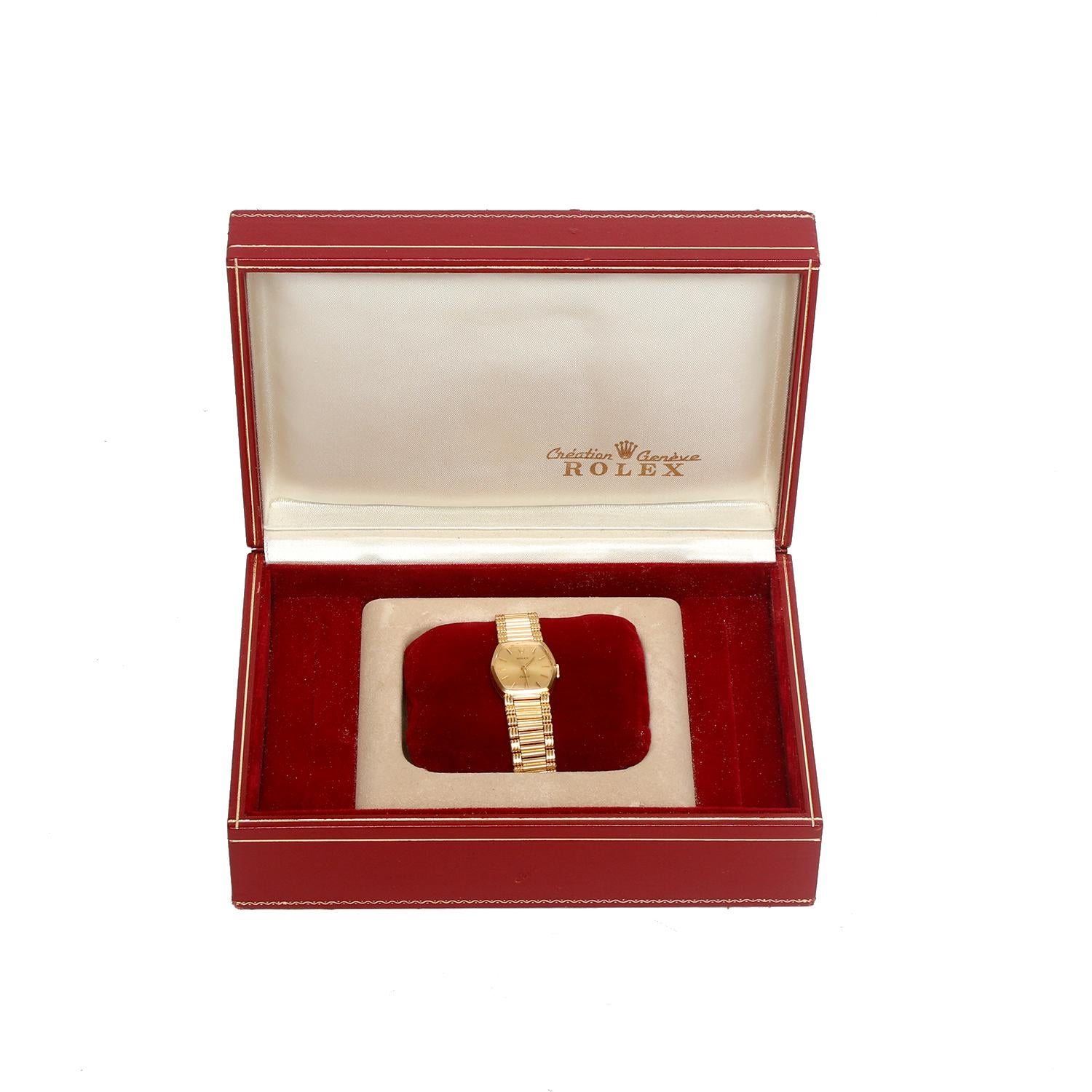 Rolex Cellini Orchid 18k Yellow Gold Ladies Watch  - Quartz. 18k yellow gold case  (22 x 26 mm diameter). Champagne dial with stick hour markers . 18K Yellow gold link bracelet. Will fit a 7 inch wrist . Pre-owned with Rolex box .