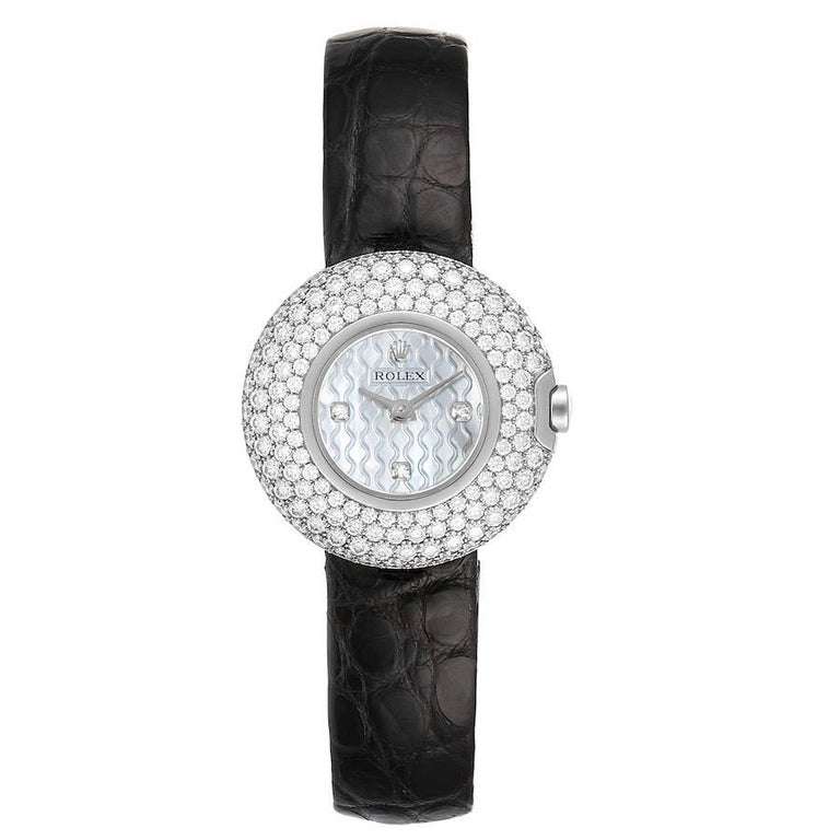 Rolex Cellini Orchid White Gold Diamond Ladies Watch 6201. Quartz movement. 18k white gold case 23.0 mm in diameter. 18k white gold bezel factory set with 141 diamond. Scratch resistant sapphire crystal. Flat profile. Textured mother of pearl dial