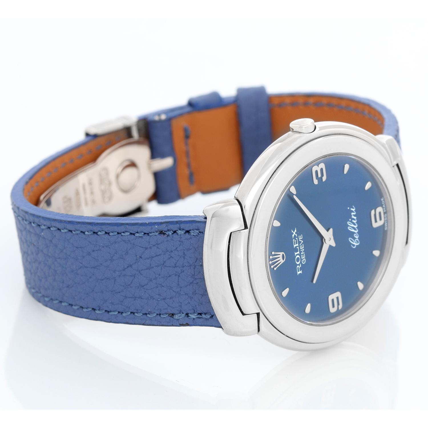Rolex Cellini  Quartz 18k White Gold Men's Watch 6623 - Quartz. 18k white gold case (37 mm ). Blue dial with Arabic numerals at  3, 6 and 9 numerals. Blue strap with 18K White gold tang buckle . Pre-owned with Rolex box.