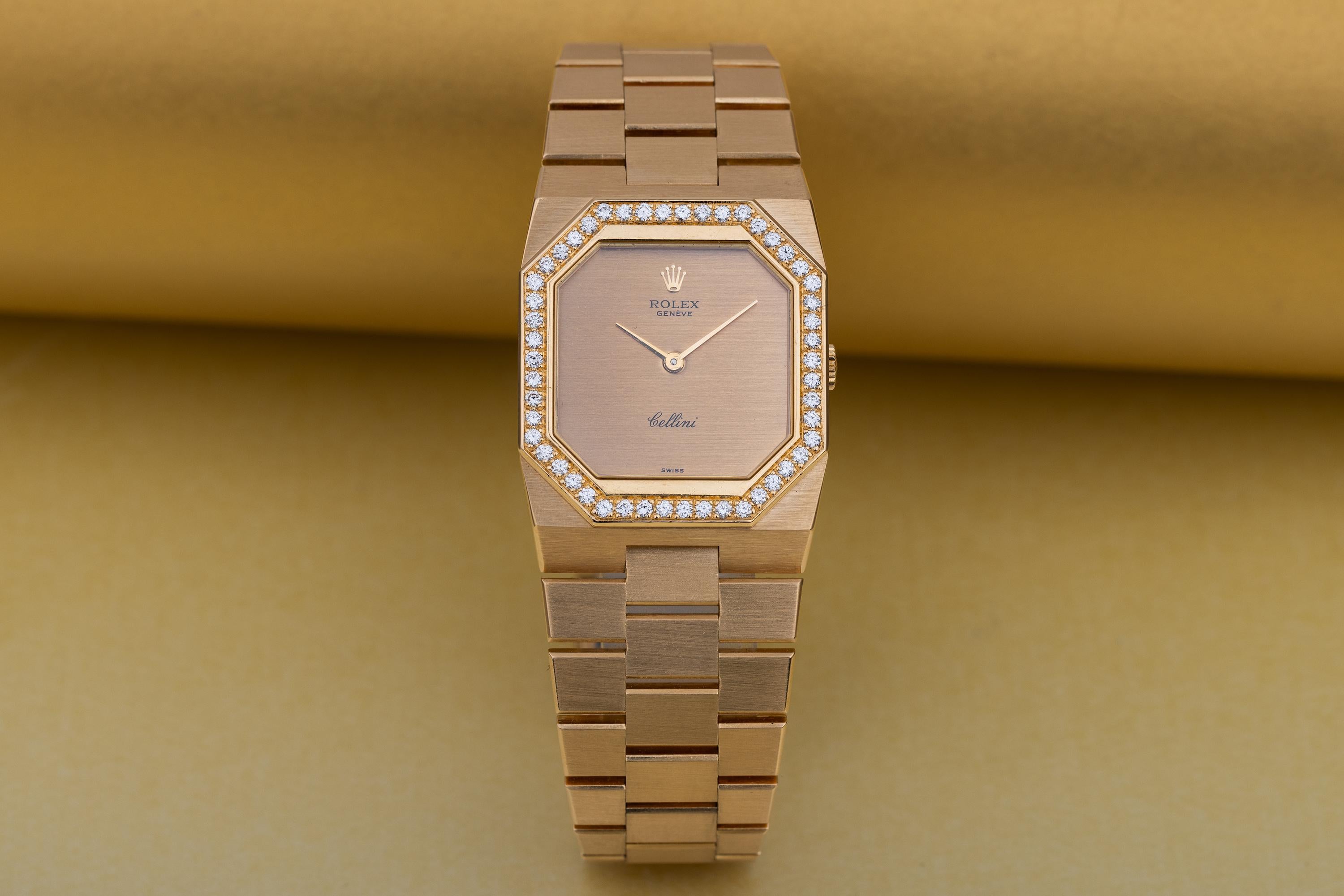 Pre-owned, excellent condition Rolex Cellini 18k Yellow Gold wristwatch. Gold dial, an 18k Yellow Gold 26.5mm case, diamond bezel, winder, bracelet and deployant clasp, sapphire crystal glass and manual winding movement.

This watch has a serial