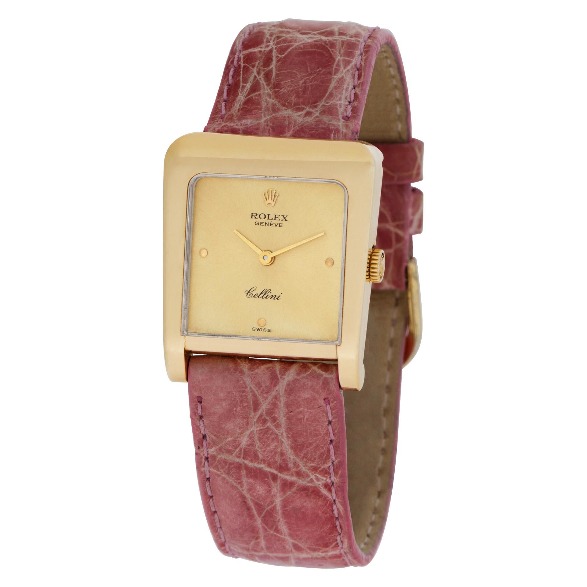 Rolex Cellini in 18k on pink crocodile strap. Manual. 25 mm case size. Ref 4100. Circa 1980s. Fine Pre-owned Rolex Watch.   Certified preowned Classic Rolex Cellini 4100 watch is made out of yellow gold on a Pink Crocodile strap with a Gold Plate
