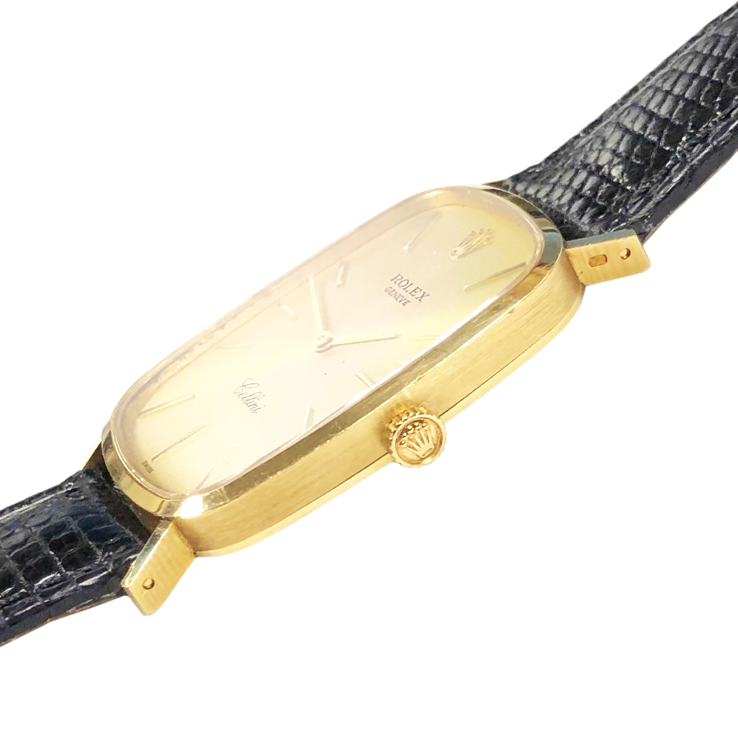 Circa 2000 Rolex Cellini Reference 4113 Wrist watch, 40 X 25 X 5 MM 18K Yellow Gold 2 Piece case. 19 Jewel Caliber 1601 Mechanical, Manual wind movement. Gold Dial with Raised Gold markers. New Black Lizard Strap with original Gold Plate Rolex