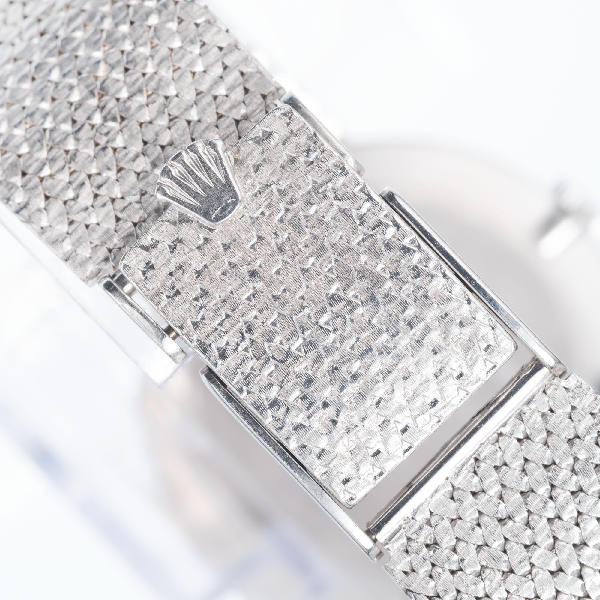 Rolex Cellini 18k white gold mesh band white dial wristwatch. 

Length: 7 ¾ Inches – can be shortened
Length: 31.02mm
Width: 30.52mm
Band width at case: 18.11mm
Case thickness: 51.1mm
Band: 18k white gold mesh
Crystal: sapphire
Dial: white with