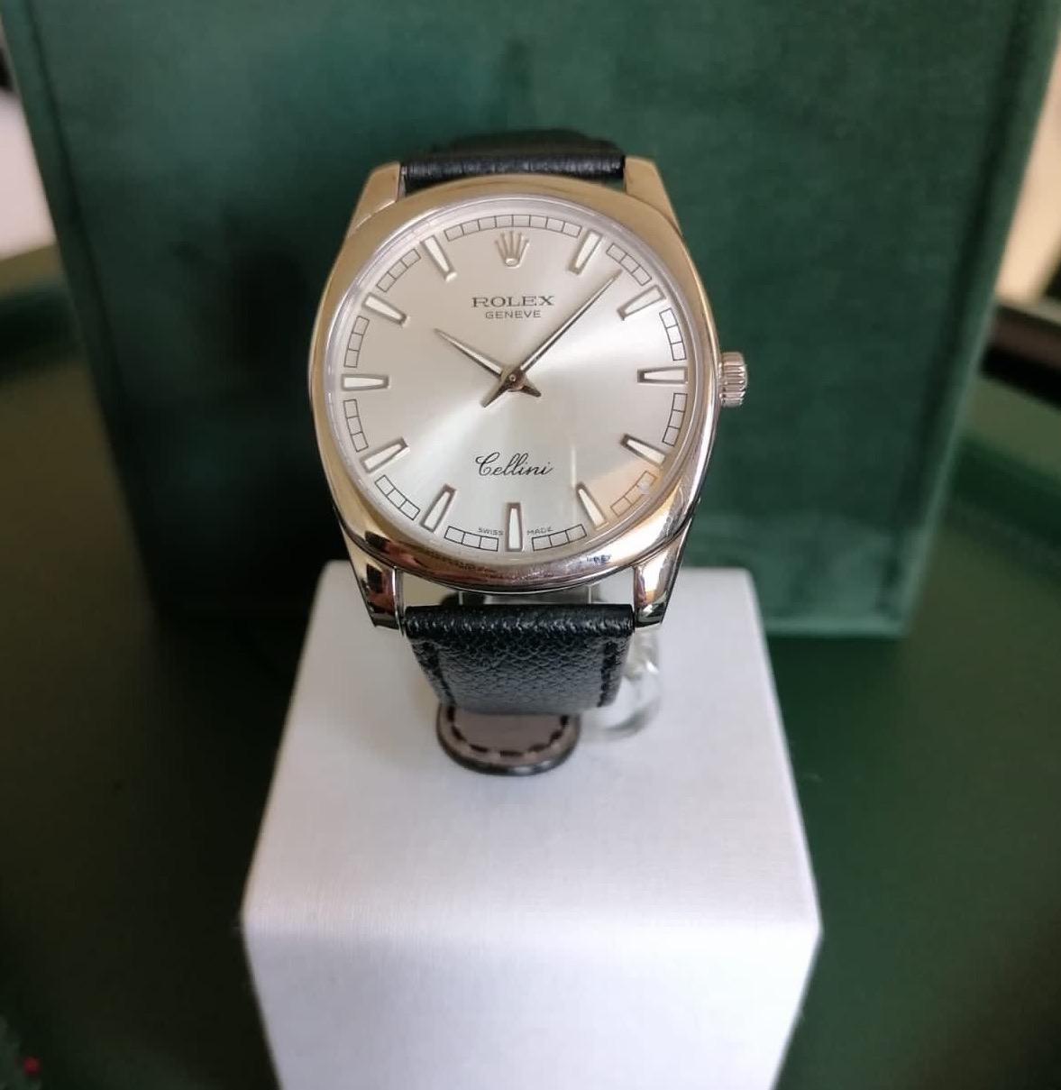 This Rolex Cellini is brand new. 

With a 38mm face made with white Gold and guarded dials in a crystal sapphire glass, it is held on the wrist with a fine black leather strap and white Gold clasp to close it. 

A timelessly classic watch which