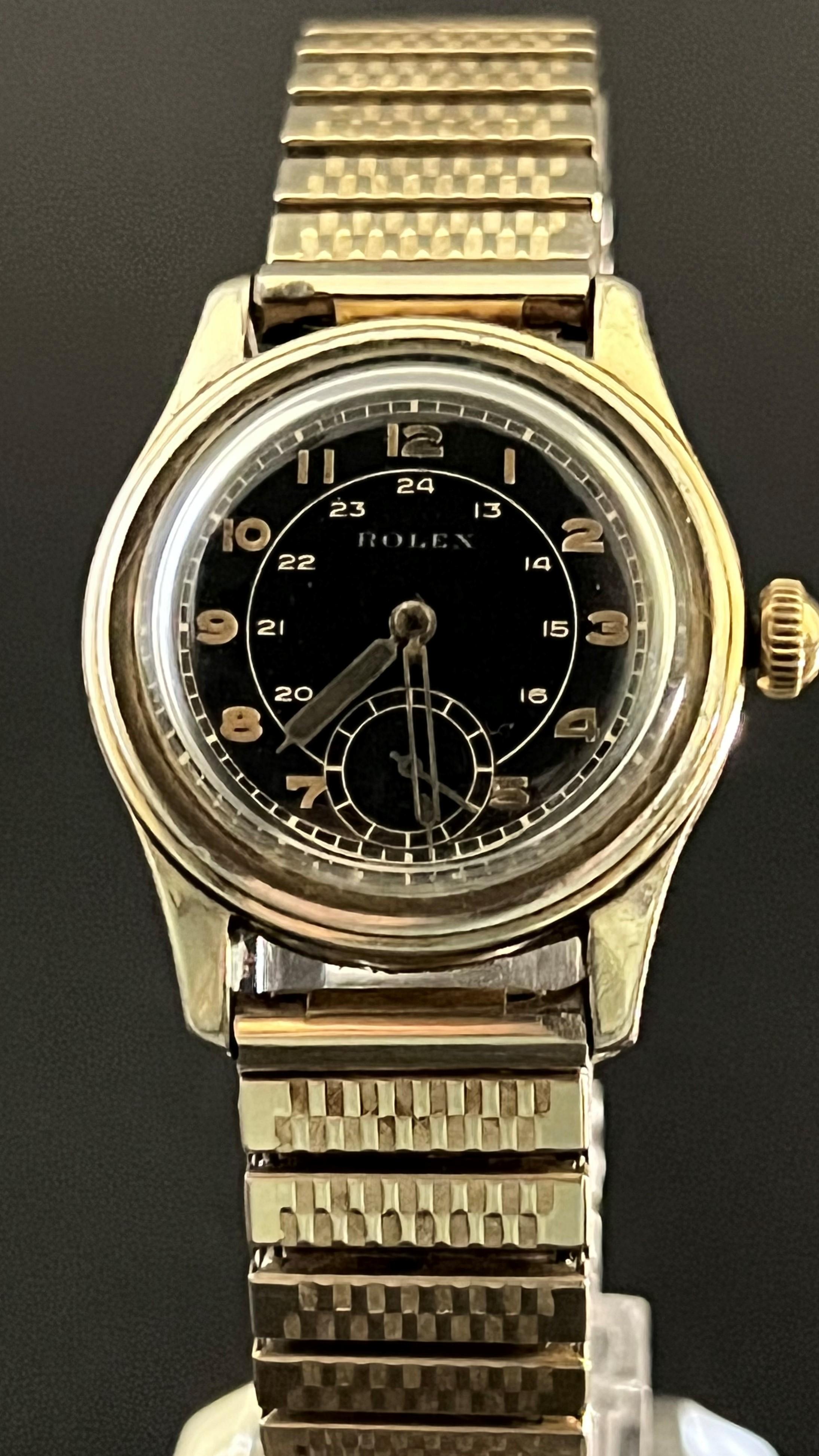 Authentic men’s WW2 era Rolex wristwatch. With black radar dial. The back bezel with ¼ century inscription and date 1917. Believed to have started indicating a watch date of c1942.

Size: The watch circumference is approximately 6” round, and the