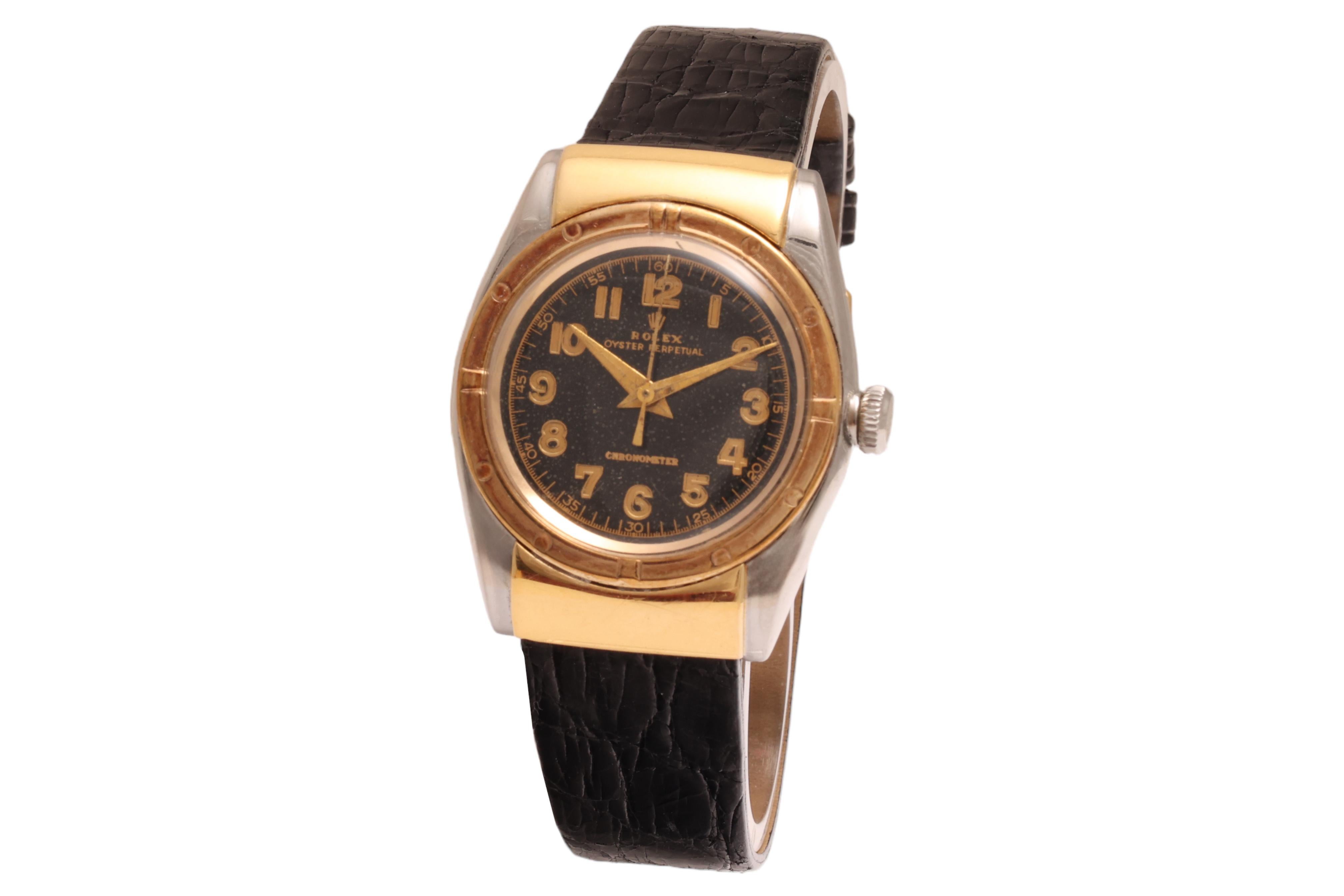 Rolex Collectors Hooded Bubble Back 1940s, very rare & collectible Rolex.

First Rolex Automatic watch !

Movement: Automatic

Case: Gold & steel case, Diameter 32 mm, thickness 12.8 mm

Dial: Black dial with gold Arabic numerals, 

Strap: Black