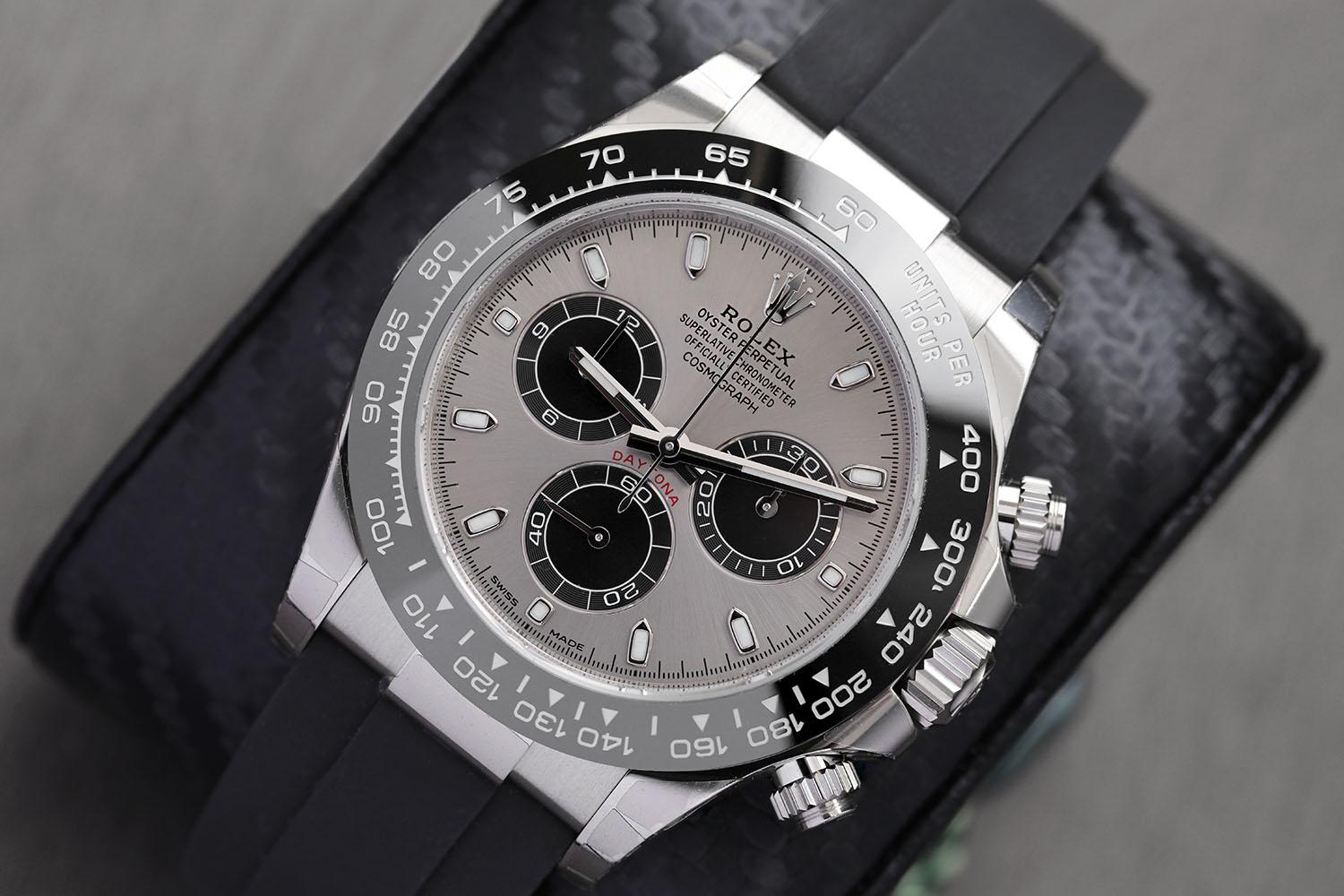 FACTORY STICKERS. 18kt white gold case with a black oysterflex band. Black monobloc cerachrom ceramic bezel. Silver dial with silver-tone hands and luminous hour markers. Tachymeter. Black Chronograph - sub-dials displaying: three - 60 second, 30