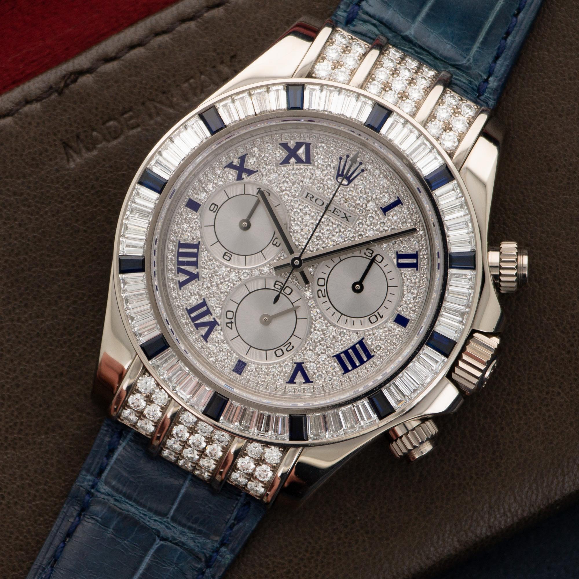 An 18k White Gold Cosmograph Daytona Diamond & Sapphire Watch by Rolex. Reference number 116599. Made in the mid 2000's. Comes on a blue crocodile Rolex Strap. In excellent Original Condition. 